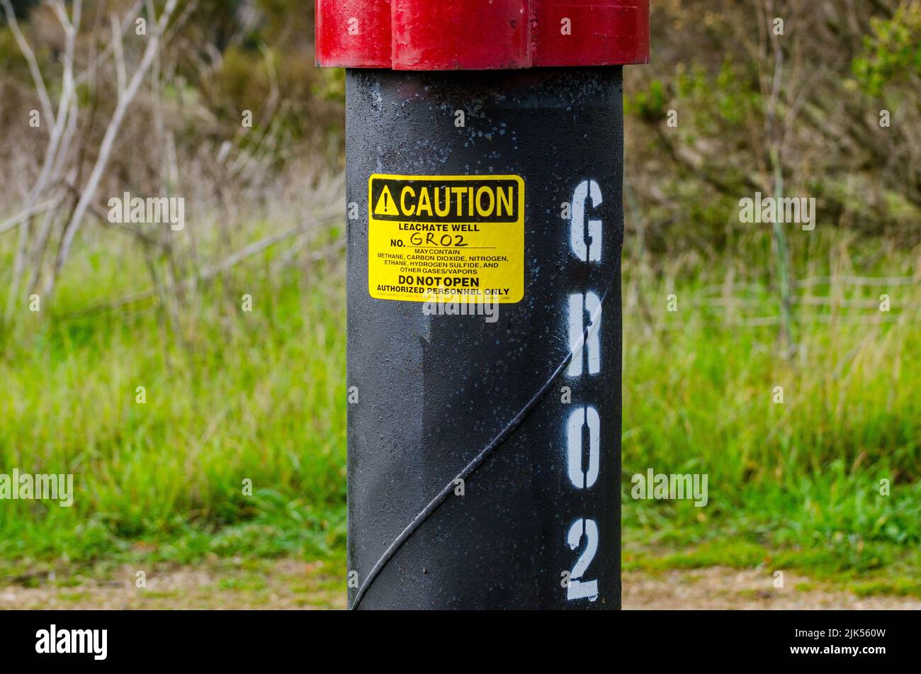 A Sign warning of hazardous conditions form a Leachate Well at the Oyster Bay Regional Shoreline Park in San Leandro California USA Stock Photo
