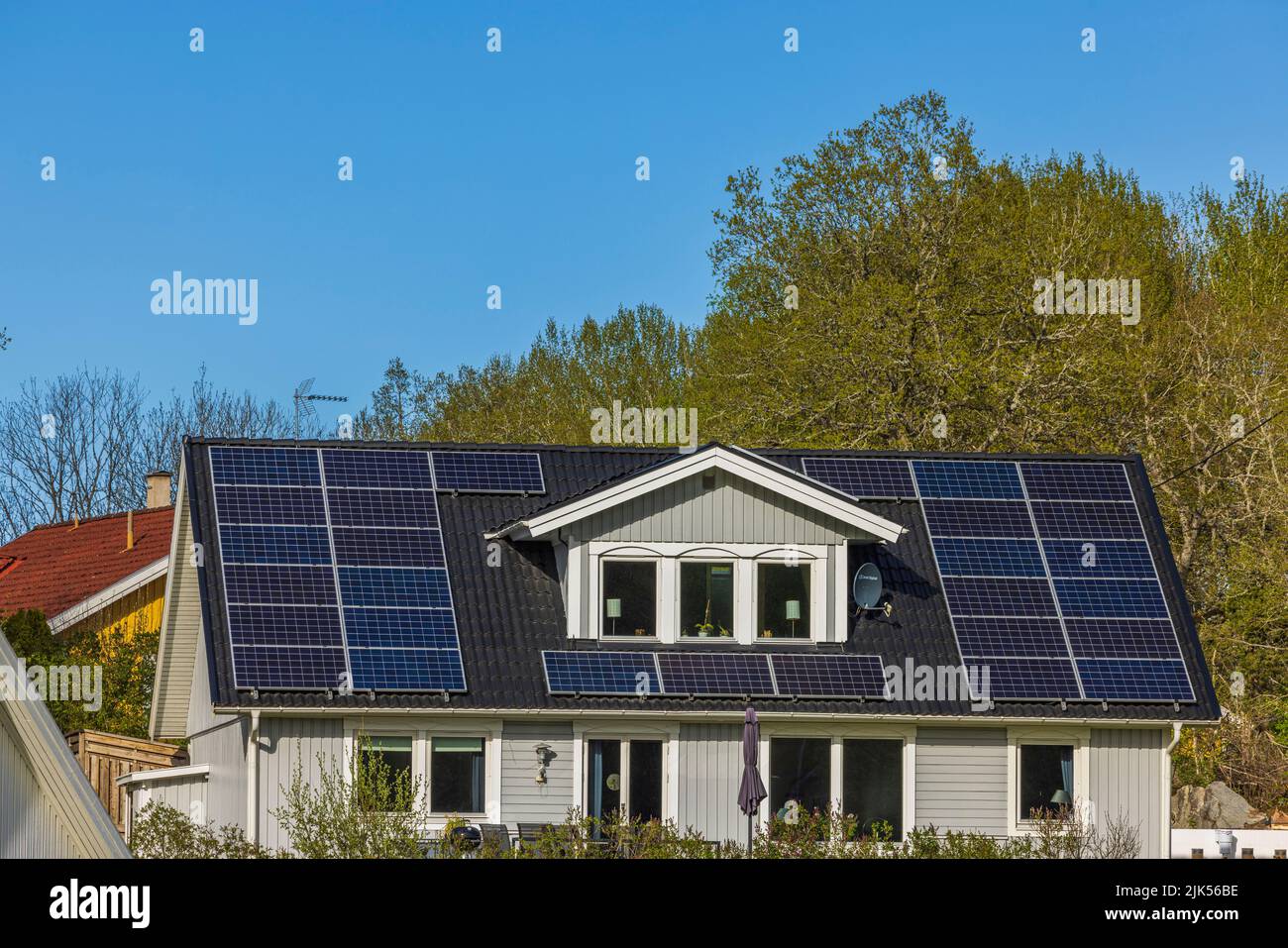 Beautiful view of house roof equipped with solar panels. Sweden