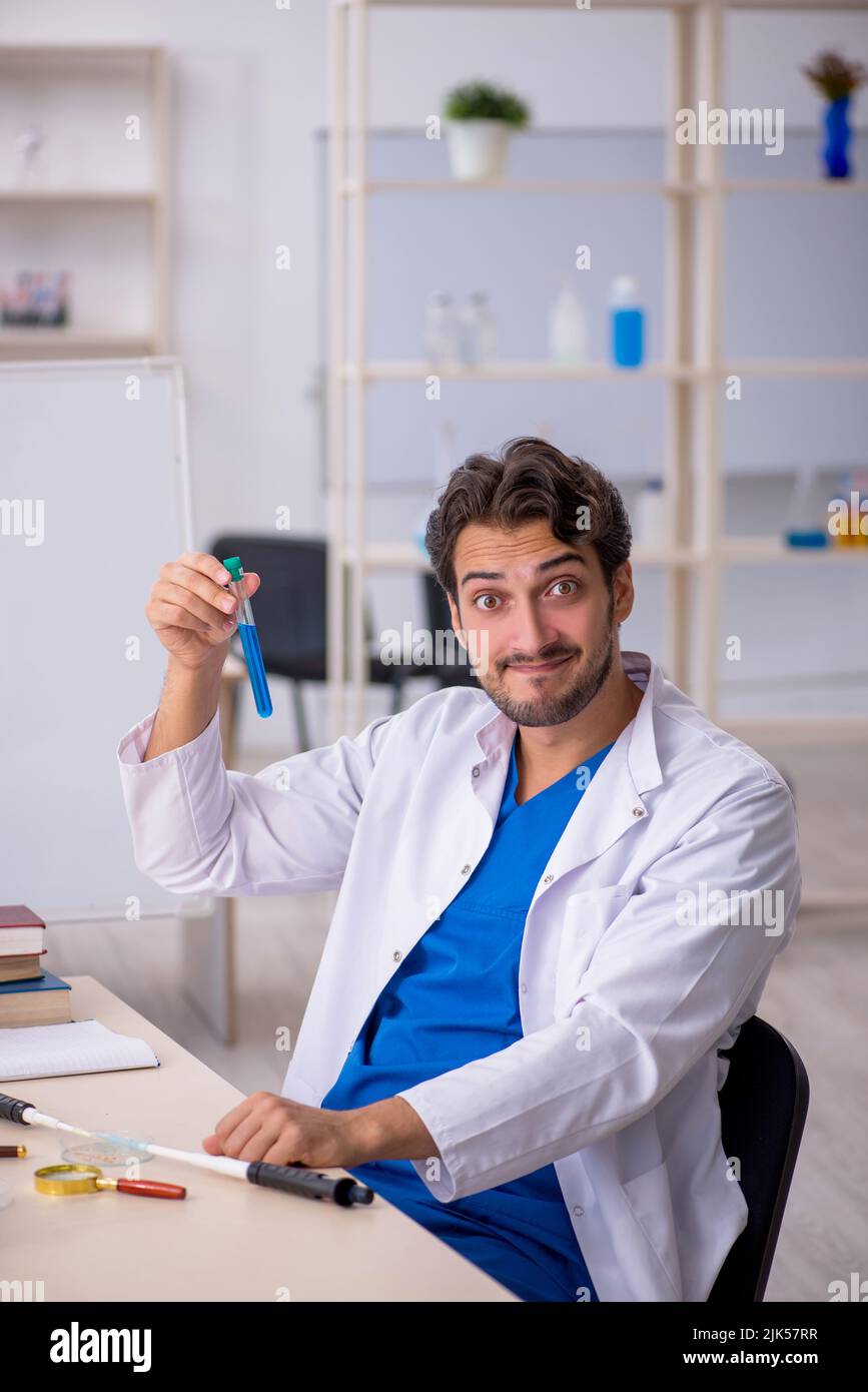 Young chemist working at the lab Stock Photo