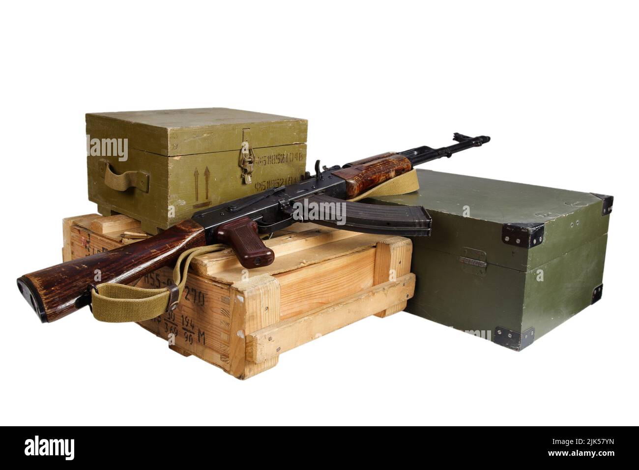 AK47 on army green ctrates with ammunition isolated on white background Stock Photo
