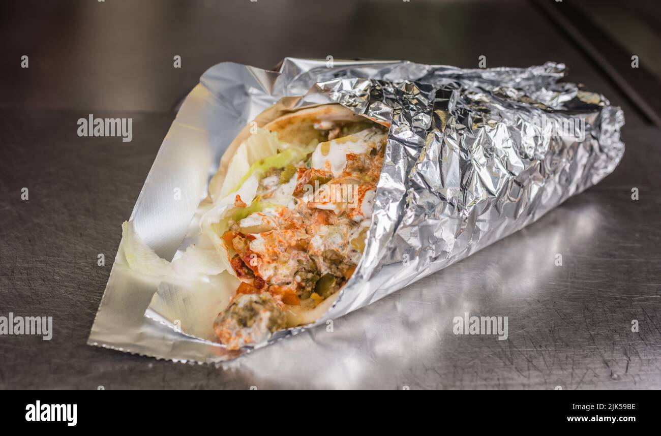 Gyro wrapped up to eat on the run in Manhattan. Stock Photo