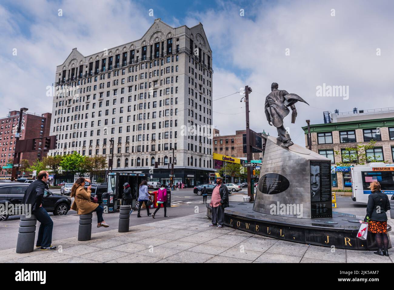 New York, NY/USA - 05-07-2016: Adam Clayton Powell statue and shops in Harlem. Stock Photo