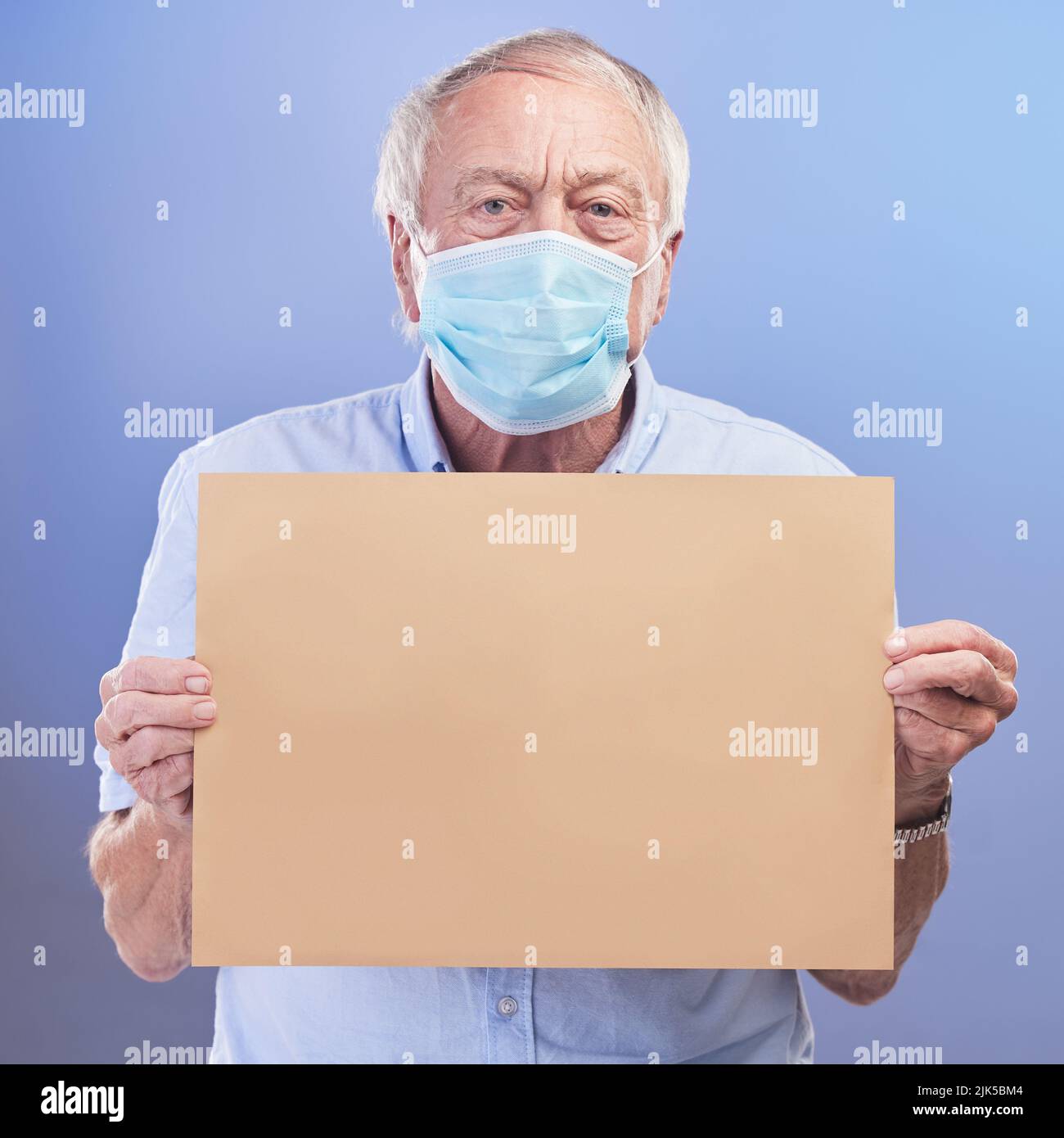 Man holding mask face hi-res stock photography and images - Alamy