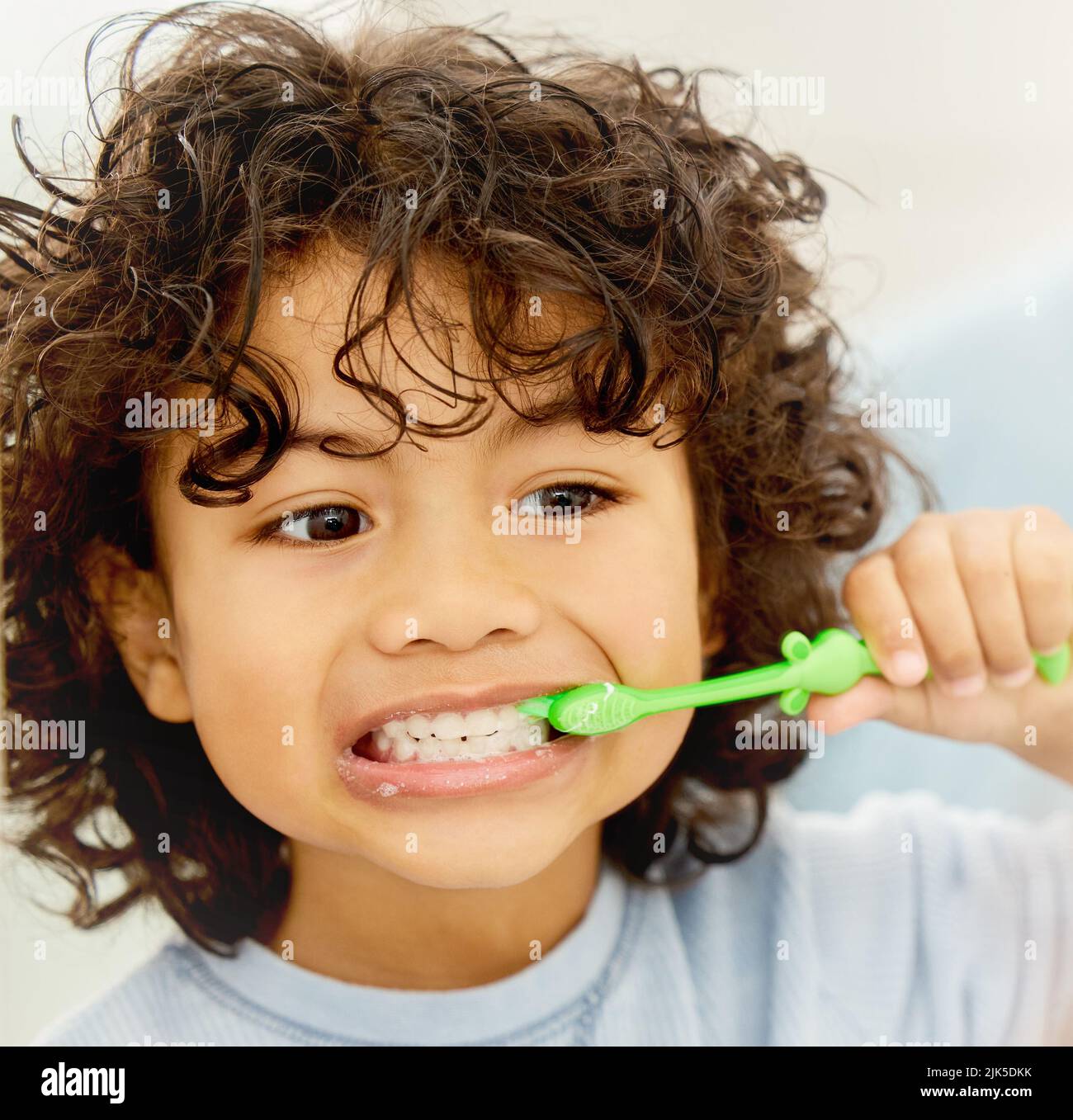 Getting to the root of the problem. a little boy brushing his teeth at home. Stock Photo