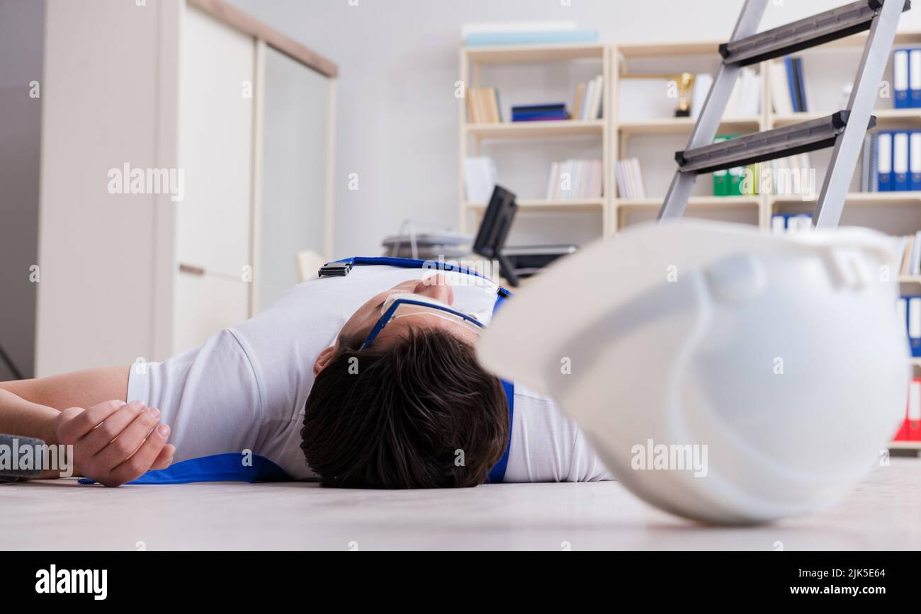 The worker after falling from height - unsafe behavior Stock Photo