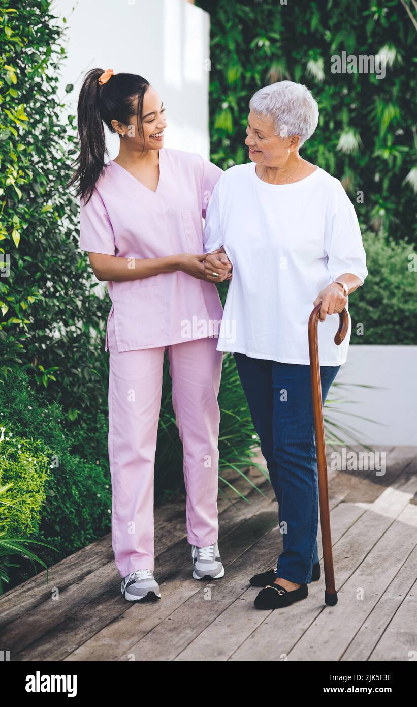Older woman with walking stick hi-res stock photography and images - Alamy