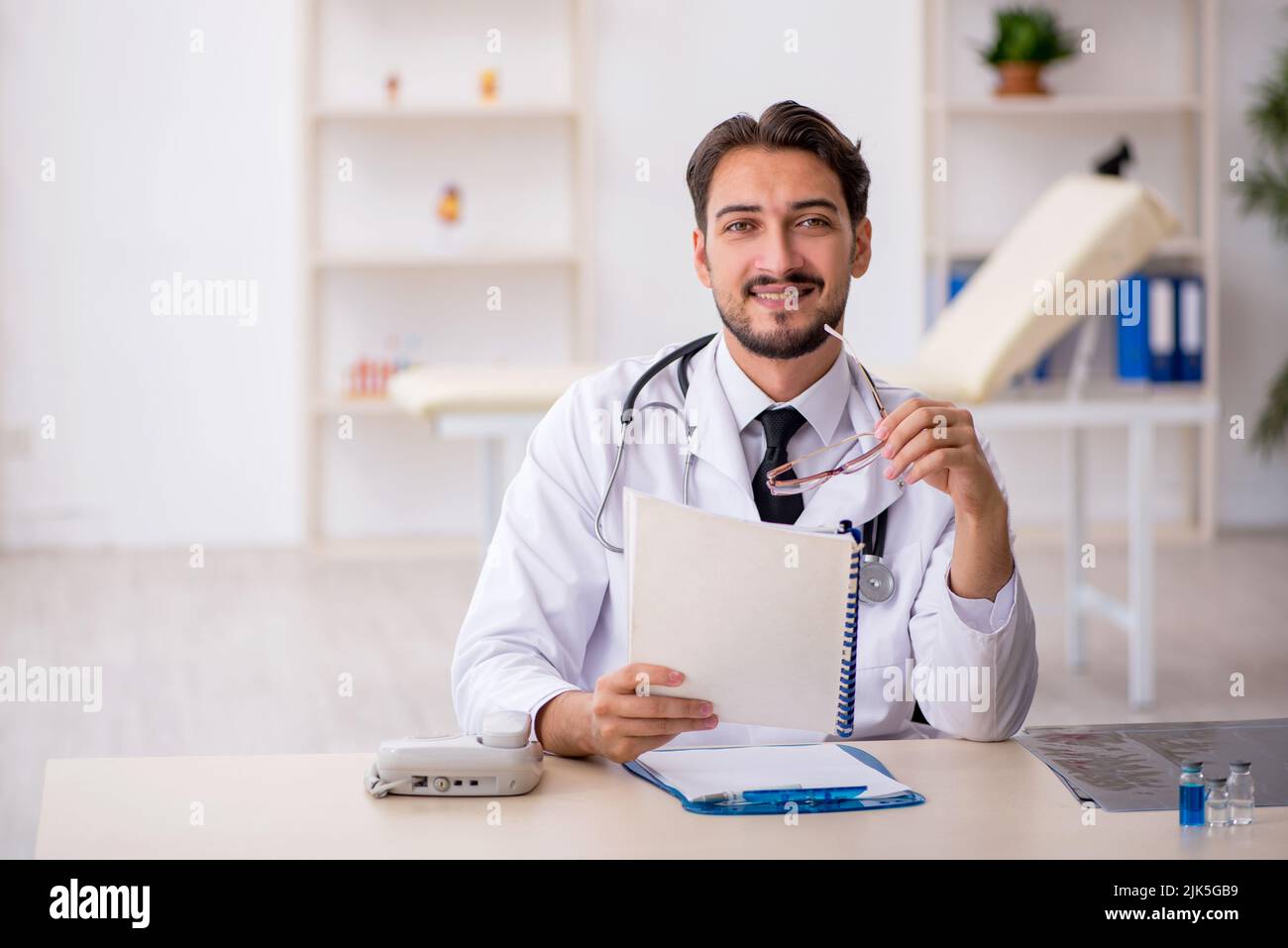 Young male doctor working at the hospital Stock Photo - Alamy