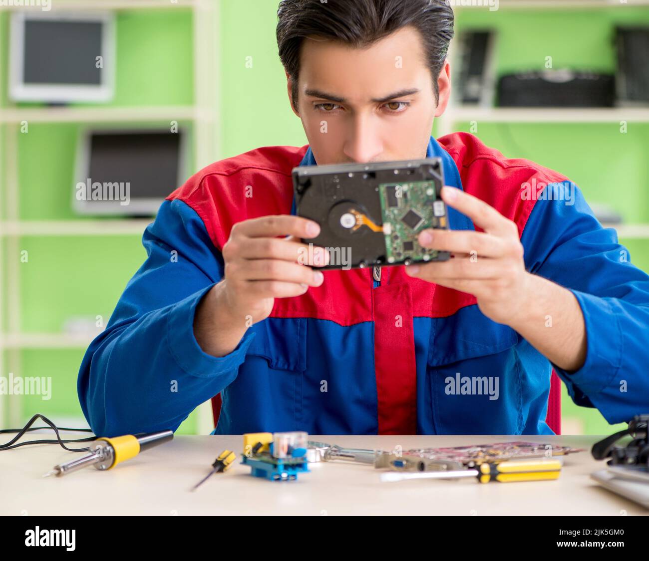 The computer engineer repairing broken desktop Stock Photo - Alamy