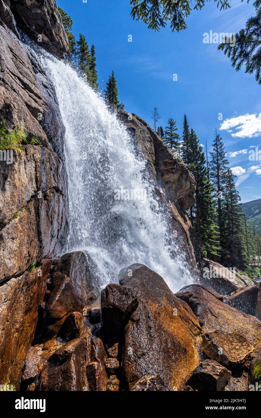Side view of mighty Ouzel Falls on a sunny day in the Wild Basin ofRocky Mountain National Park, Colorado. Stock Photo
