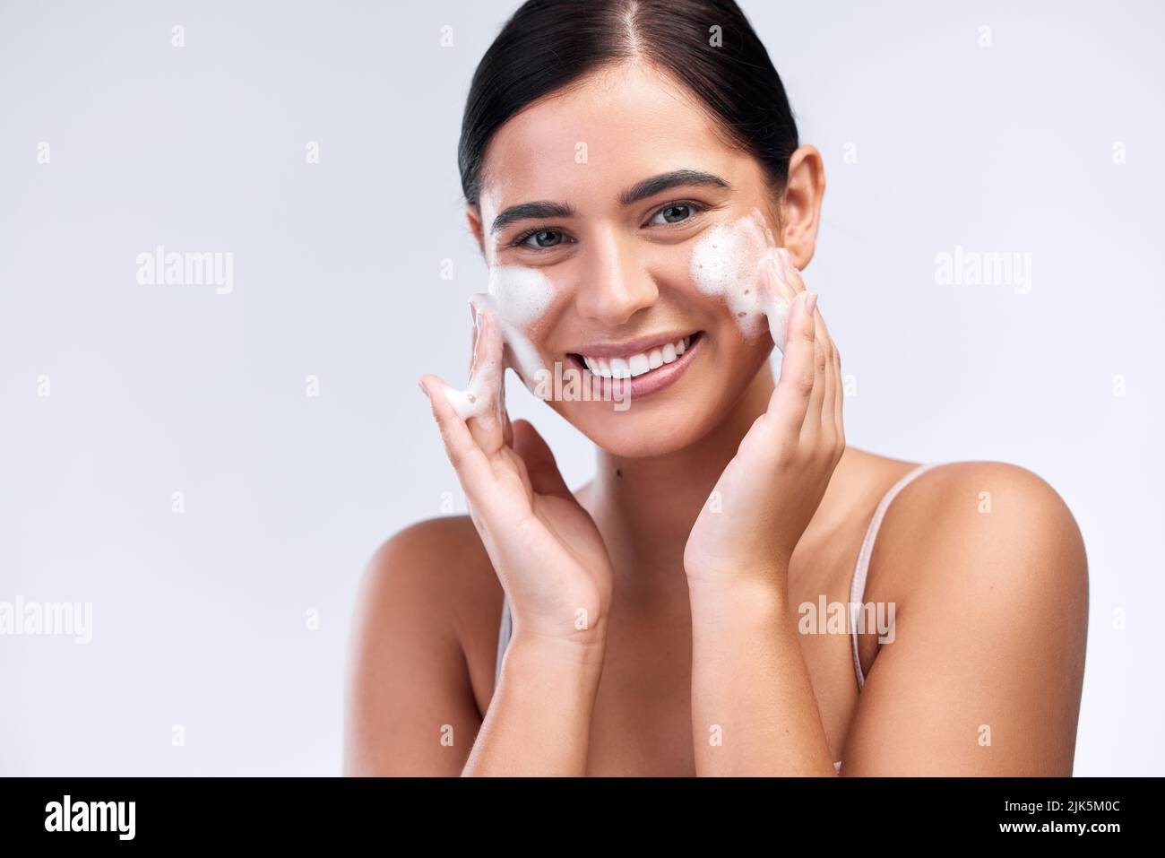 Proper skin care means cleansing it properly. Studio shot of a