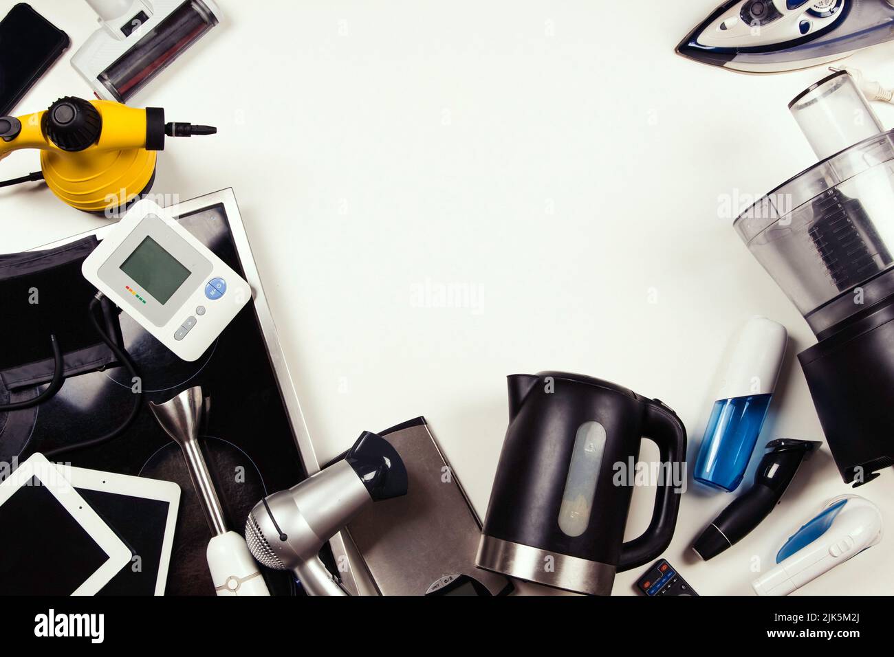 https://c8.alamy.com/comp/2JK5M2J/old-household-electrical-appliances-broken-computers-tablets-phones-used-electronic-gadgets-devices-on-white-background-planned-obsolescence-2JK5M2J.jpg