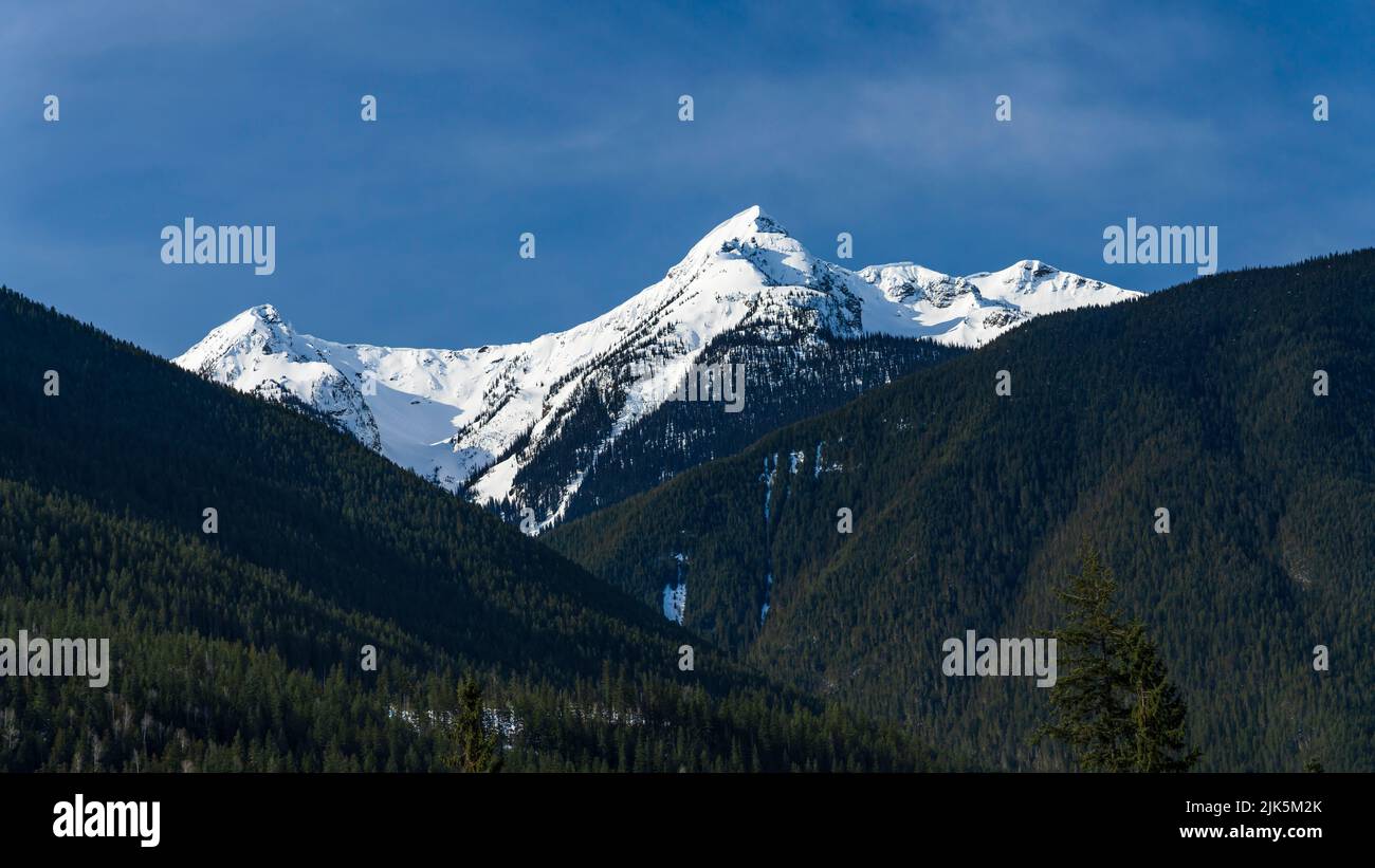 A snow capped mountain peak near Revelstoke, British Columbia, Canada. Stock Photo