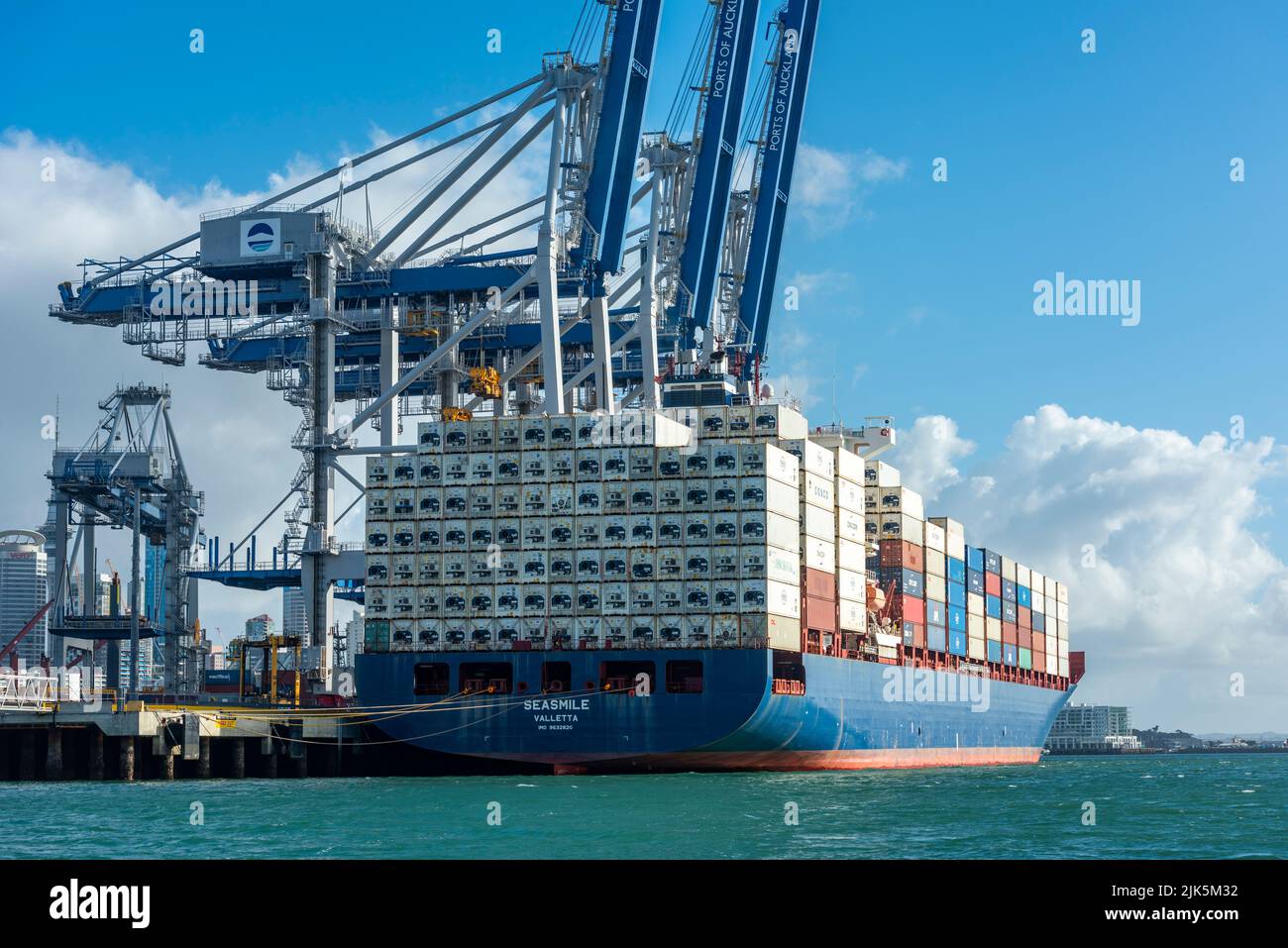 Container Ship Seasmile docked at the Ports of Auckland container terminal. Stock Photo