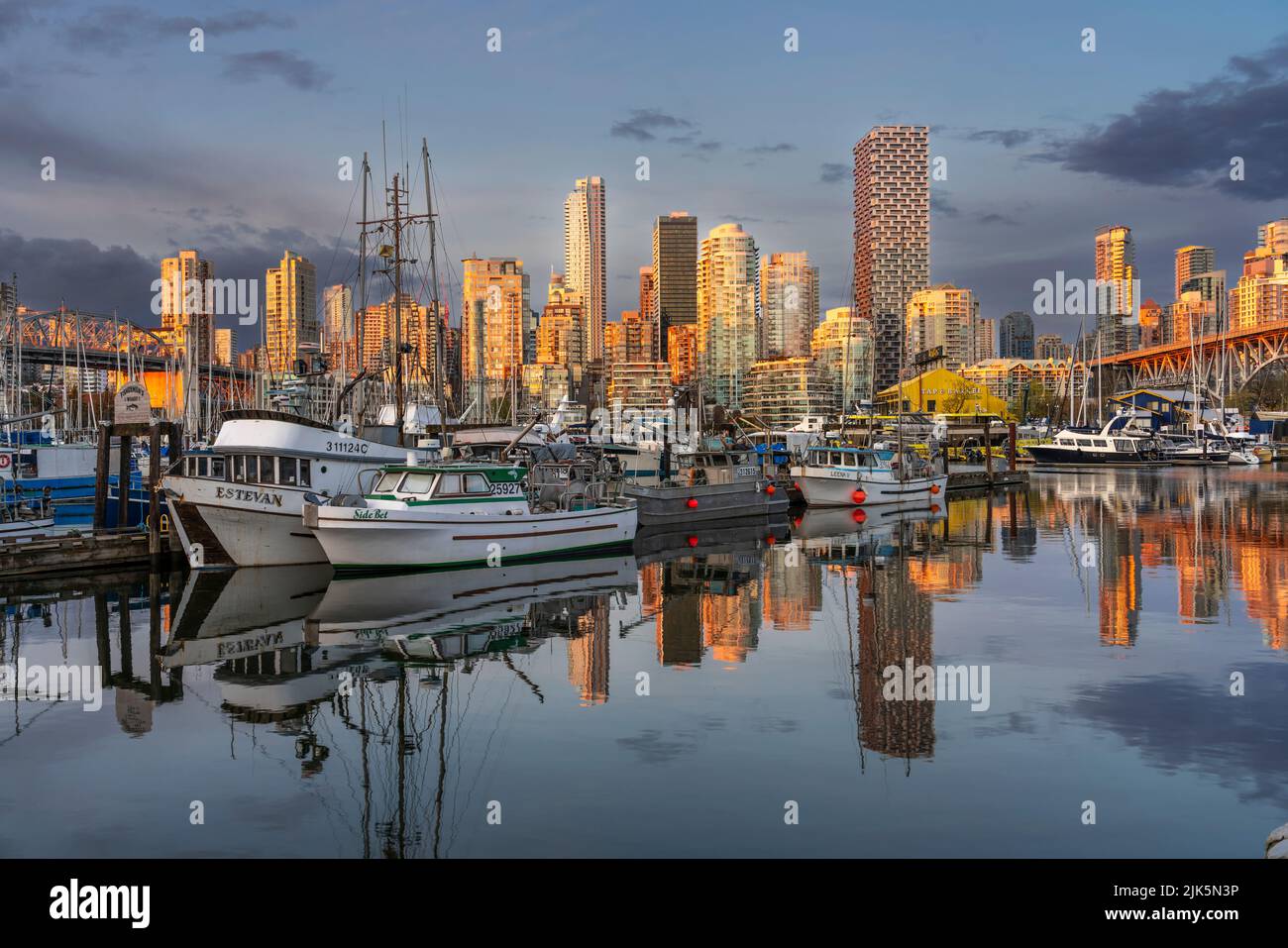 False Creek with reflections of boats and buildings in Vancouver, British Columbia, Canada. Stock Photo