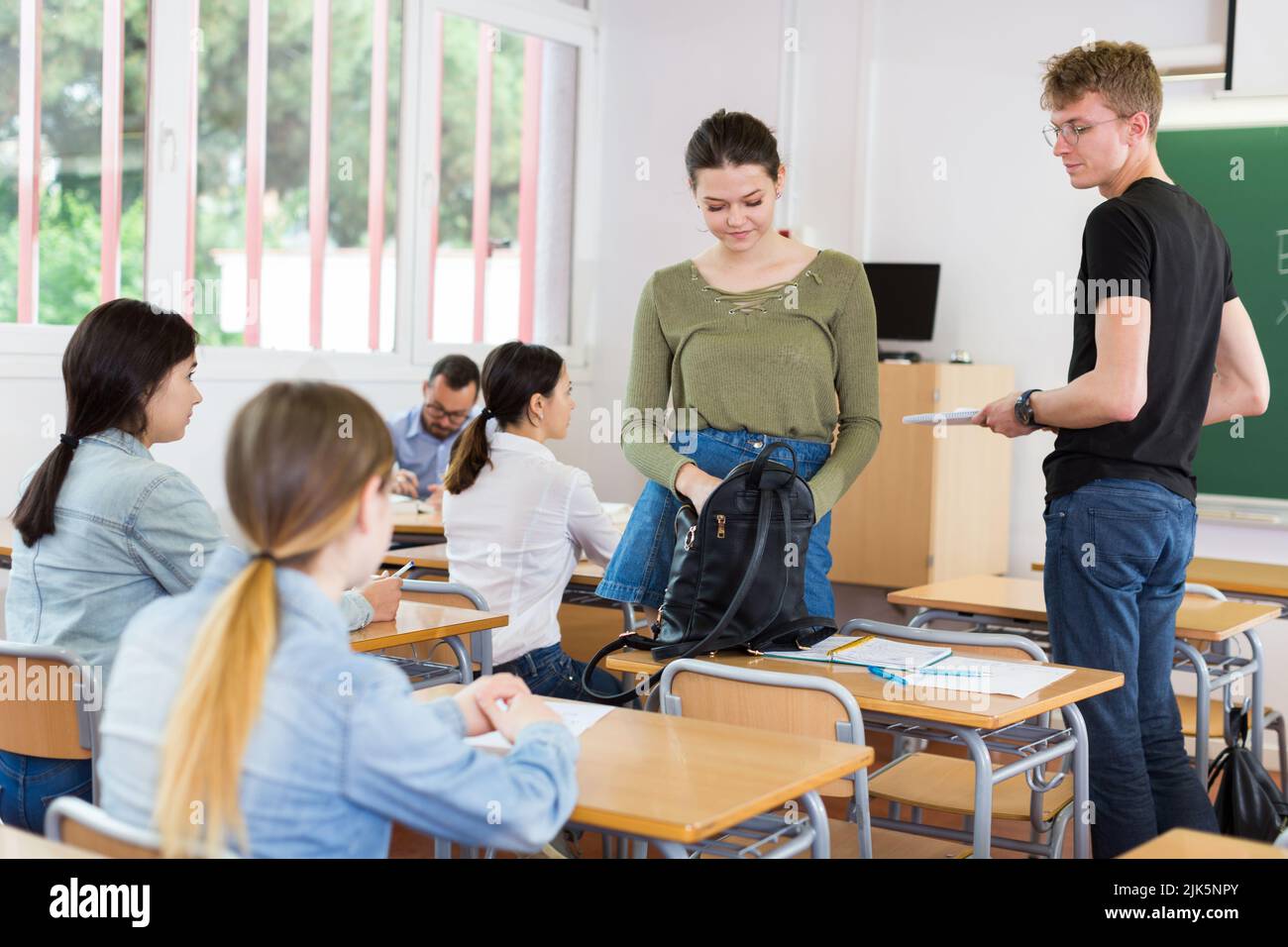 Girls and boys are preparing for lecture Stock Photo - Alamy