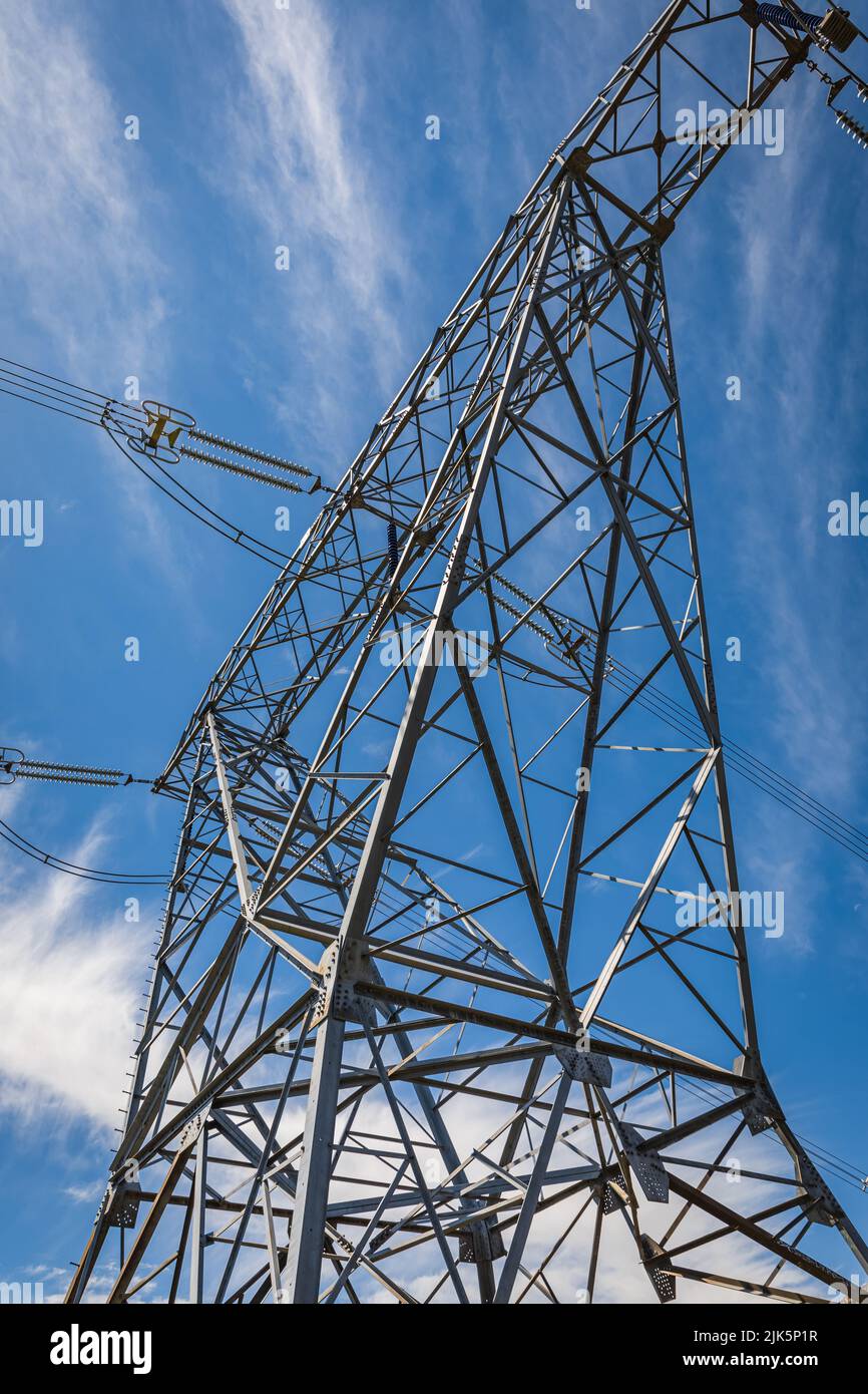 Electric power. High voltage post or High voltage tower in the blue sky background, nobody Stock Photo