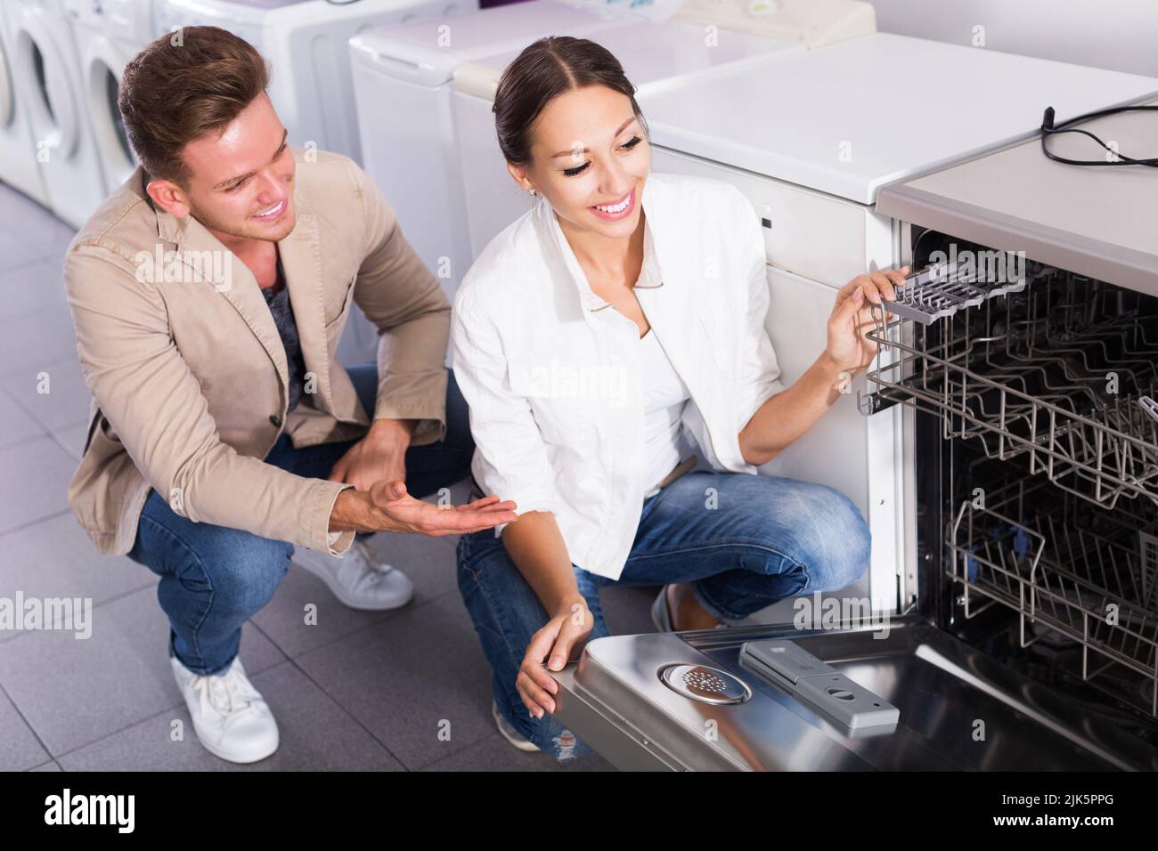 Family selecting modern dishwasher Stock Photo Alamy