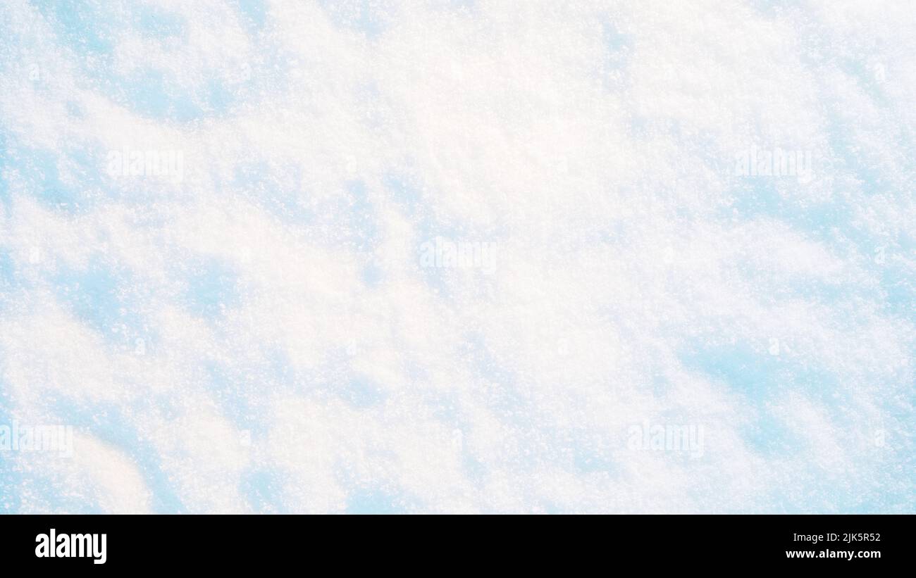 White snow texture in sunlight. Bright Christmas background Stock Photo