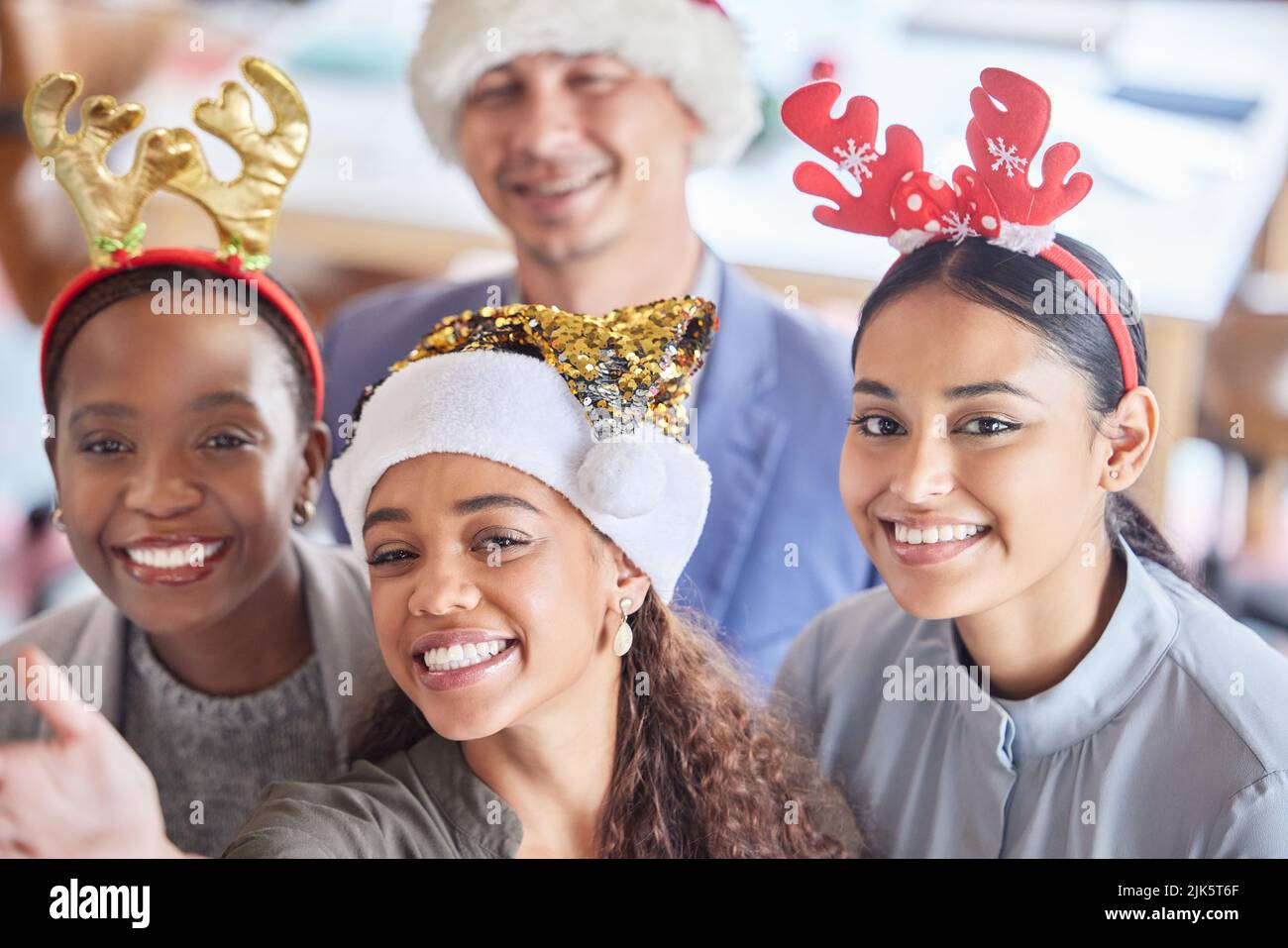 Put on your best party hats. a group of colleagues taking a selfie ...