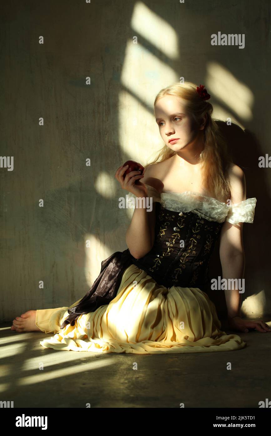 Perfect woman with blonde hair in sun light, actress in love story or fairy tale Stock Photo