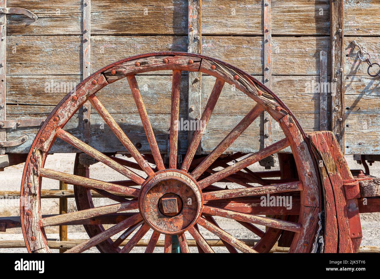 The spoked wheel on an old wooden wagon Stock Photo