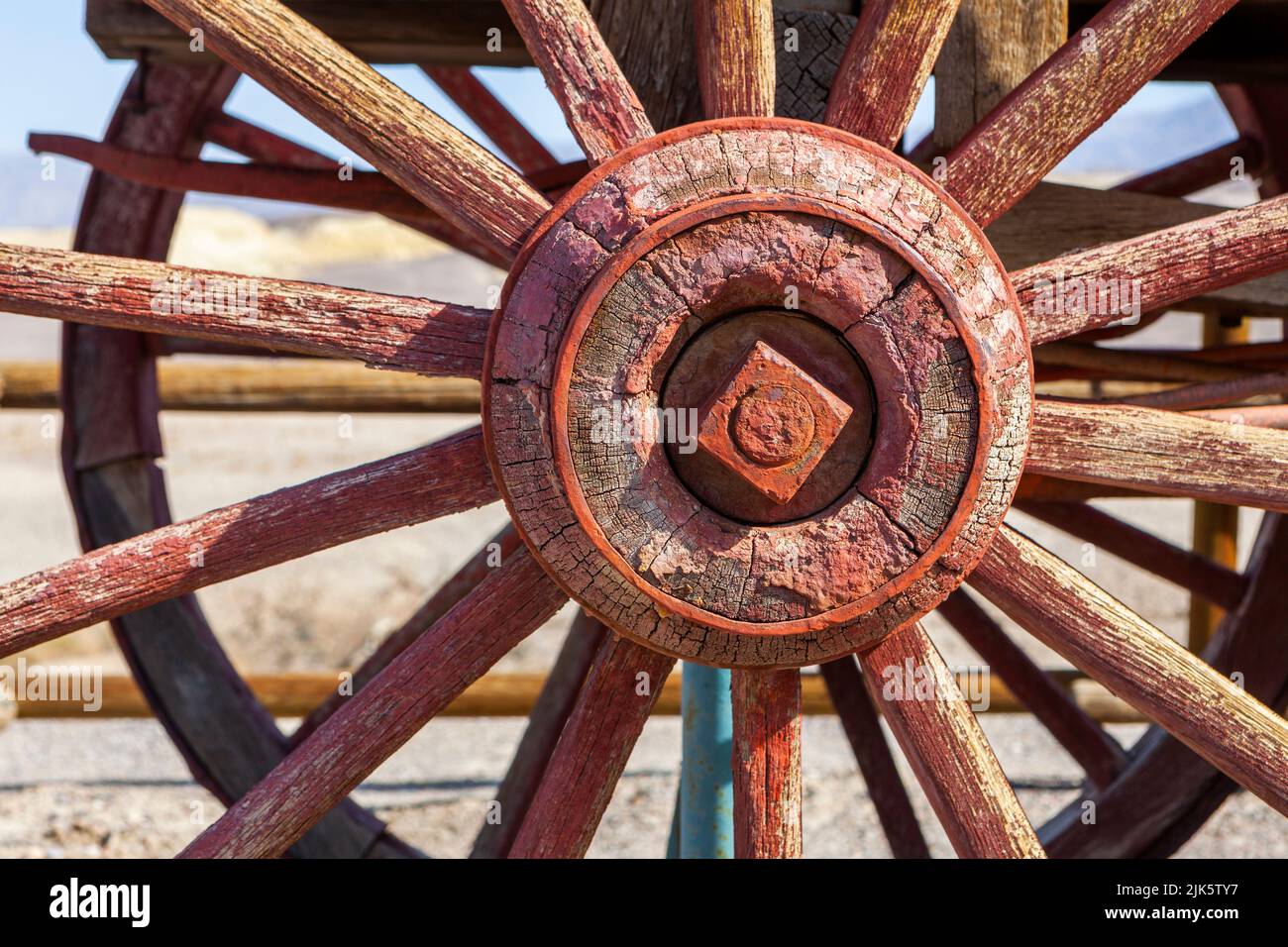 The spoked wheel on an old wooden wagon in Death Valley Stock Photo