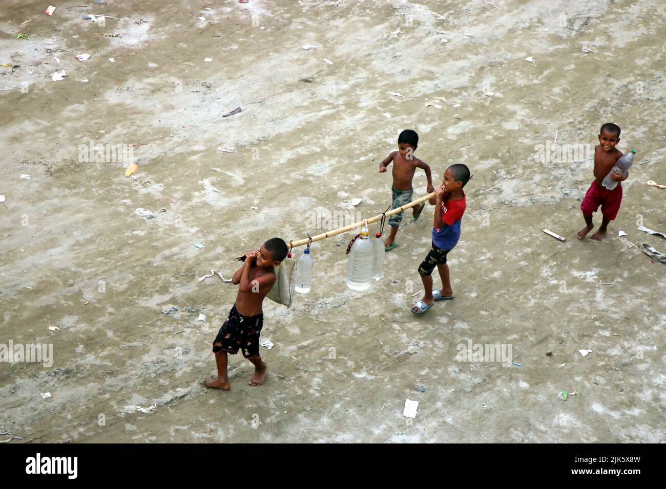 Children are collecting drinking water from the mosque in the Shyampur