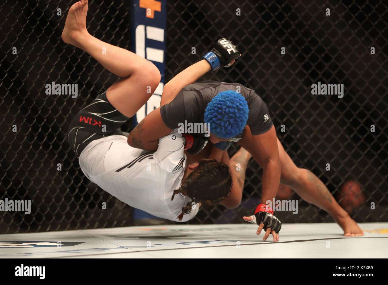 DALLAS, TX - JULY 30: (R-L) Joselyne Edwards takes down Ji Yeon Kim in their Women’s Bantamweight bout during the UFC 277 event at American Airlines Center on July 30, 2022, in Dallas, Texas, United States. (Photo by Alejandro Salazar/PxImages) Credit: Px Images/Alamy Live News Stock Photo