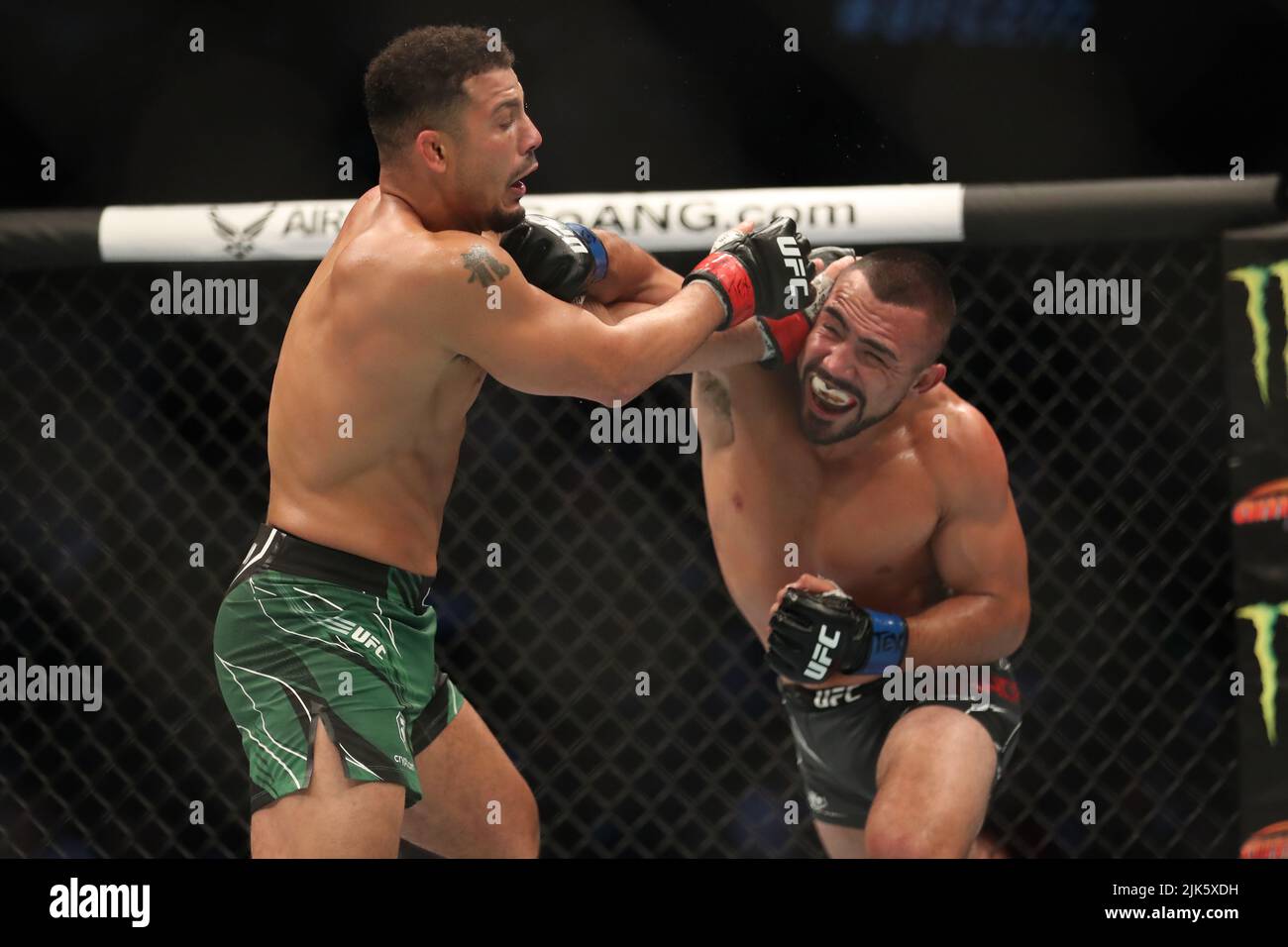 DALLAS, TX - JULY 30: (R-L) Rafa Garcia punches Drakkar Klose in their Lightweight bout during the UFC 277 event at American Airlines Center on July 30, 2022, in Dallas, Texas, United States. (Photo by Alejandro Salazar/PxImages) Credit: Px Images/Alamy Live News Stock Photo