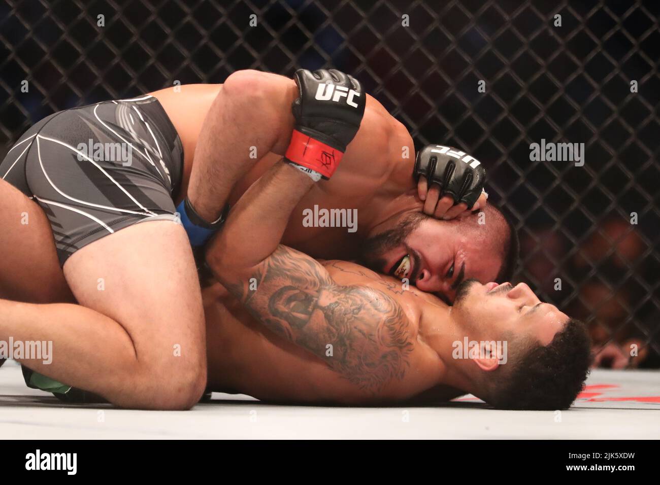 DALLAS, TX - JULY 30: Rafa Garcia (top) controls the body of Drakkar Klose in their Lightweight bout during the UFC 277 event at American Airlines Center on July 30, 2022, in Dallas, Texas, United States. (Photo by Alejandro Salazar/PxImages) Credit: Px Images/Alamy Live News Stock Photo