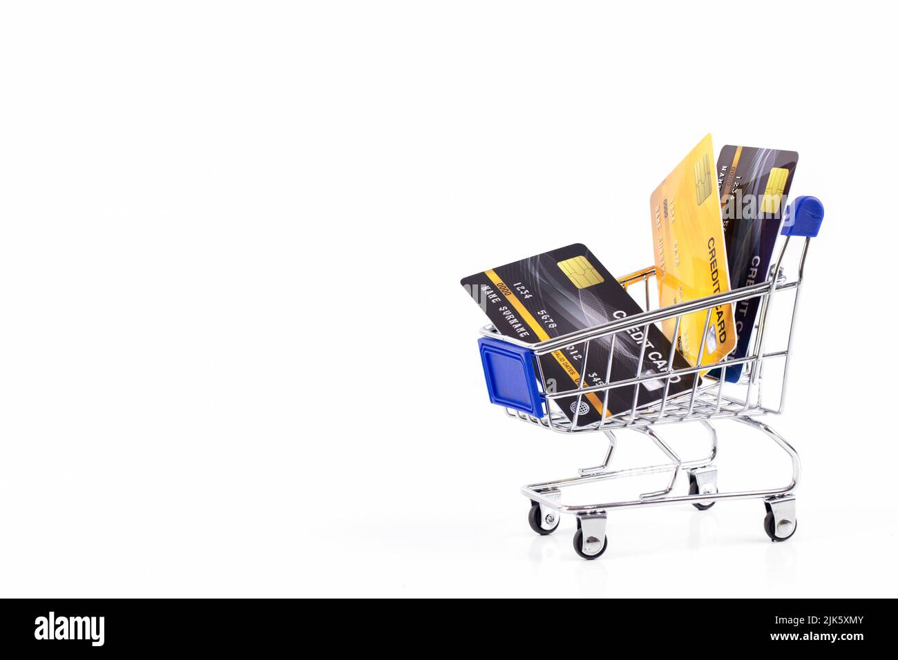Credit cards in a shopping cart isolate on white background , business shopping online payment concept Stock Photo
