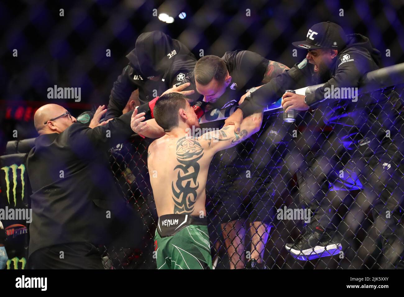 DALLAS, TX - JULY 30: Brandon Moreno celebrates his victory over Kai Kara-France with his team in their Flyweight bout during the UFC 277 event at American Airlines Center on July 30, 2022, in Dallas, Texas, United States. (Photo by Alejandro Salazar/PxImages) Credit: Px Images/Alamy Live News Stock Photo