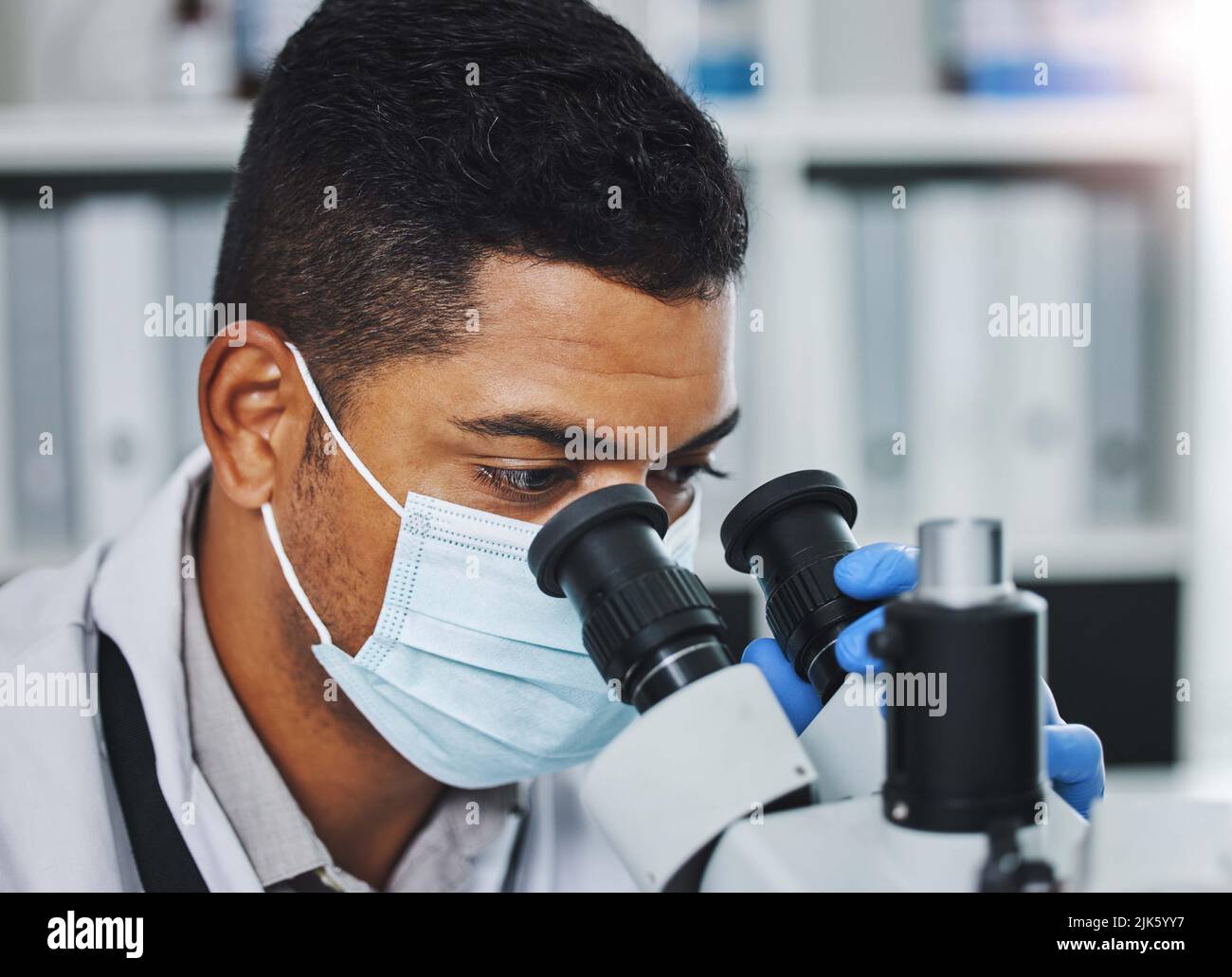 If you believe it, you can see it. a young male researcher working in a ...