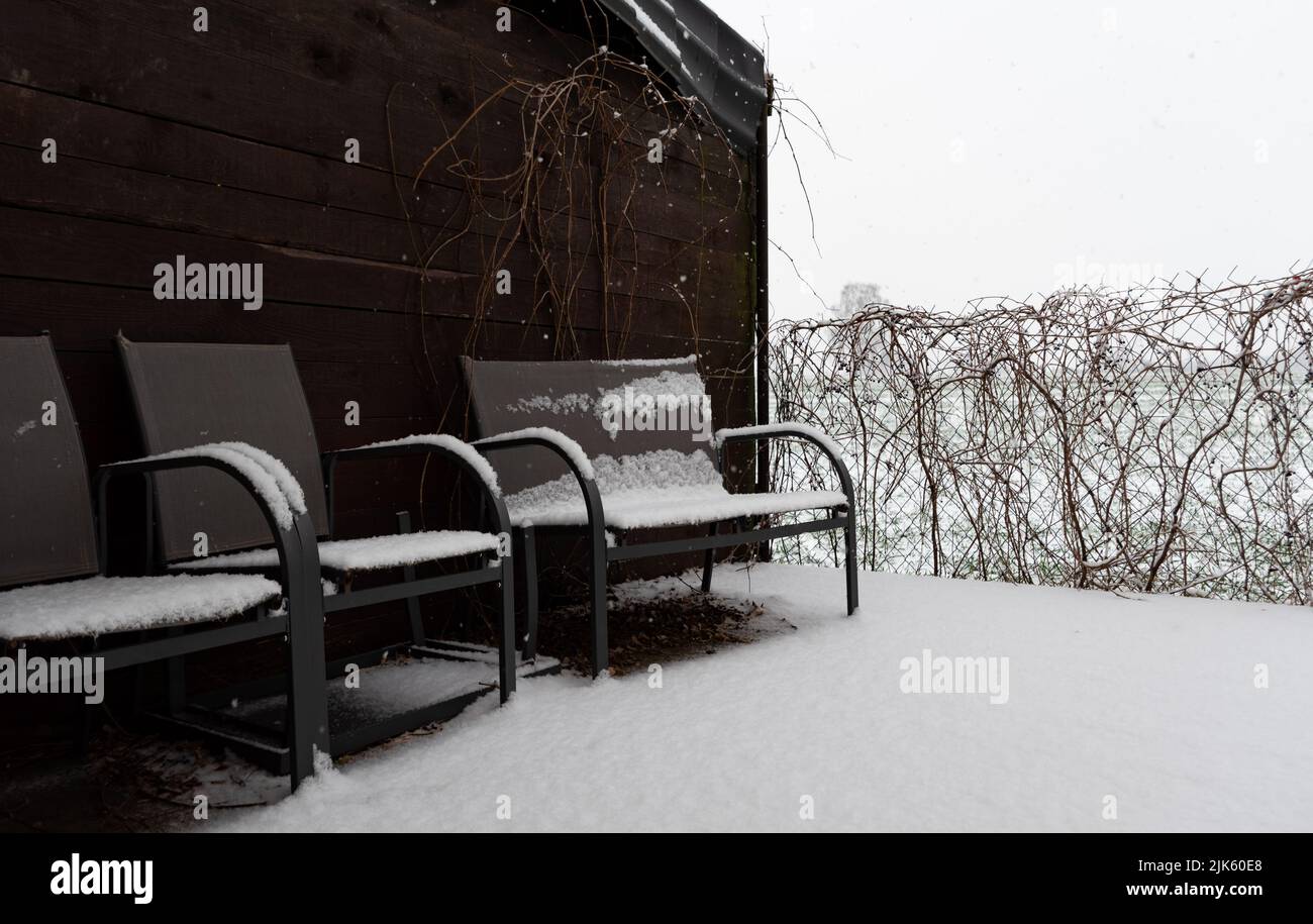 Garden furniture under the snow. Winter precipitation and a thick layer