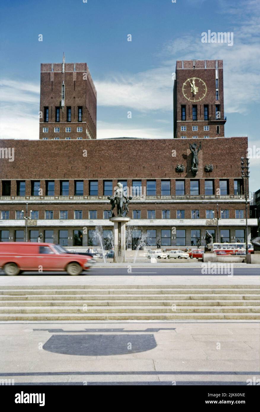 The City Hall, Oslo, Norway in 1970. This modern, imposing red brick building is on the waterfront in the Pipervika district of the capital city. Designed by Arnstein Arneberg and Magnus Poulsson, work started in 1931 but progress was halted by the outbreak of World War II.  It was finally inaugurated in 1950. The administrative seat of the City Council houses important murals and artworks from celebrated Norwegian painters and sculptors. Here, within its walls, the prestigious Nobel Peace Prize ceremony is held. This image is from an amateur 35mm colour transparency – a vintage 1970s photo. Stock Photo