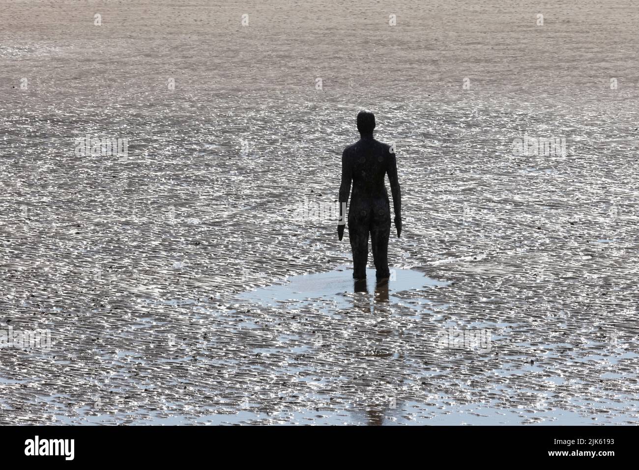 Another Place by Antony Gormley on Crosby Beach at low tide Stock Photo