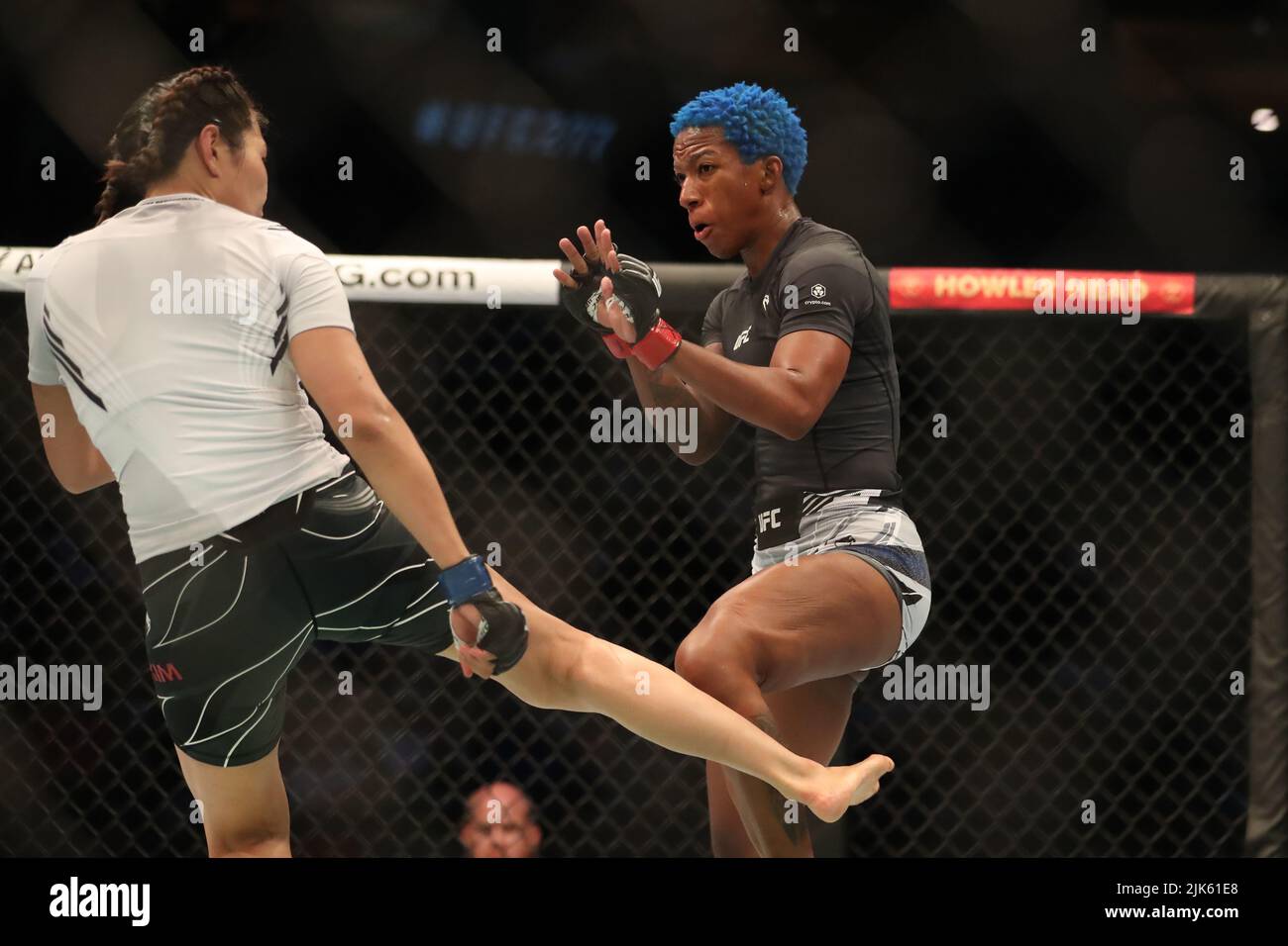 July 30, 2022, Dallas, Texas, Dallas, TX, United States: DALLAS, TX - JULY 30: (L-R) Ji Yeon Kim kicks Joselyne Edwards in their Womenâ€™s Bantamweight bout during the UFC 277 event at American Airlines Center on July 30, 2022, in Dallas, Texas, United States. (Credit Image: © Alejandro Salazar/PX Imagens via ZUMA Press Wire) Stock Photo