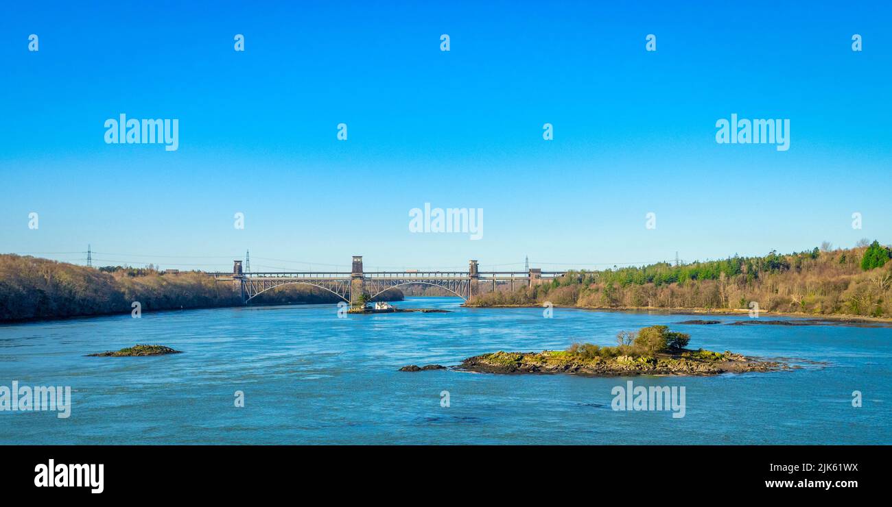 The turbulent part of the Menai Strait known as The Swellies, and the Britannia Bridge to Anglesey. The bridge was designed by Robert Stephenson. Stock Photo