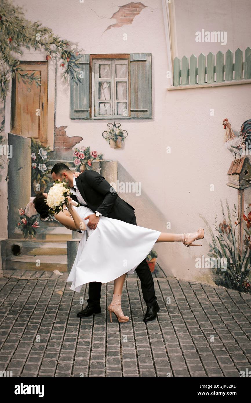 Wedding couple indoors is hugging each other Stock Photo - Alamy