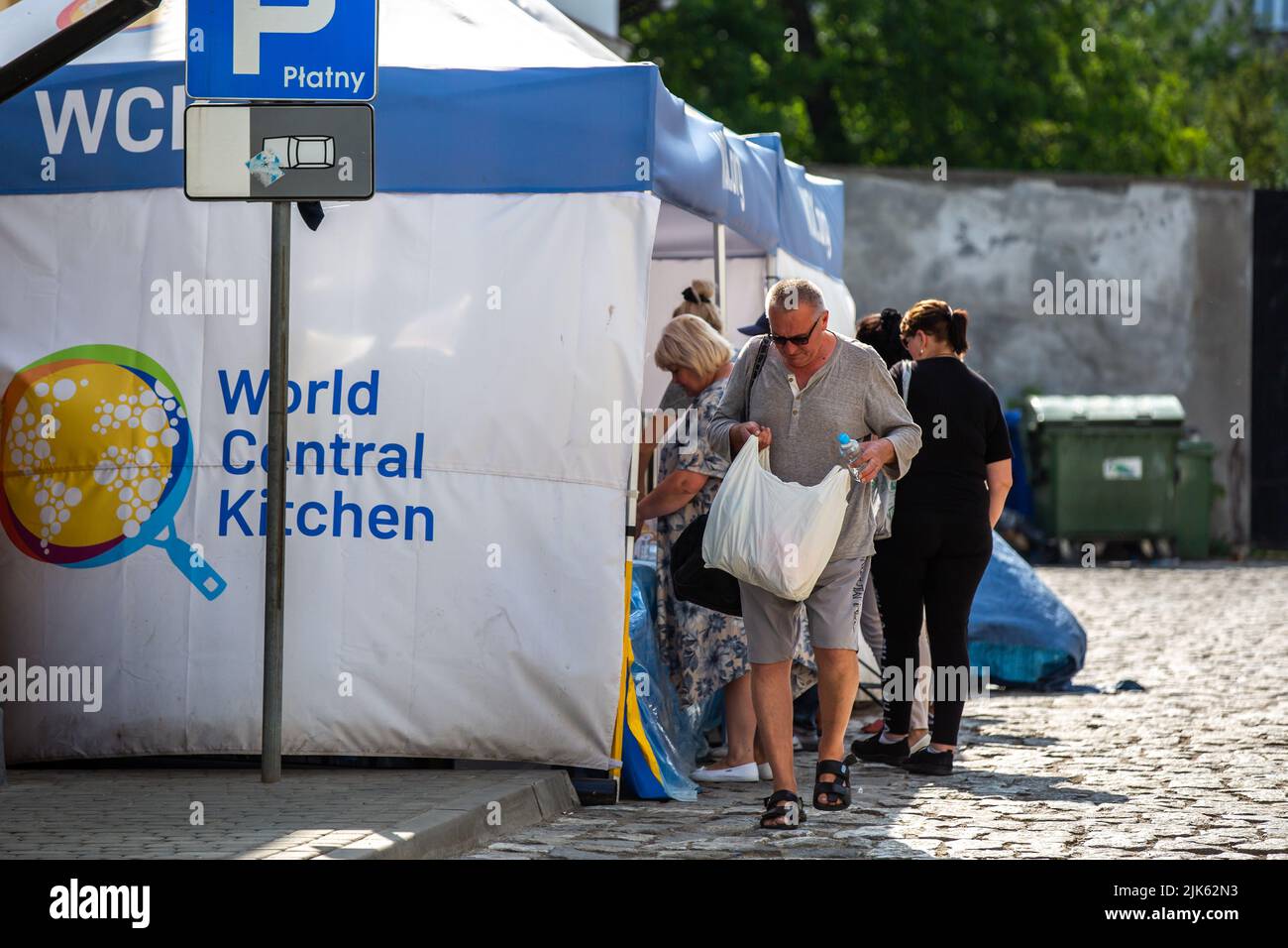 Przemysl, Poland - July 24, 2022: Unidentified people at the World Central Kitchen tent in Przemysl, Poland. Stock Photo