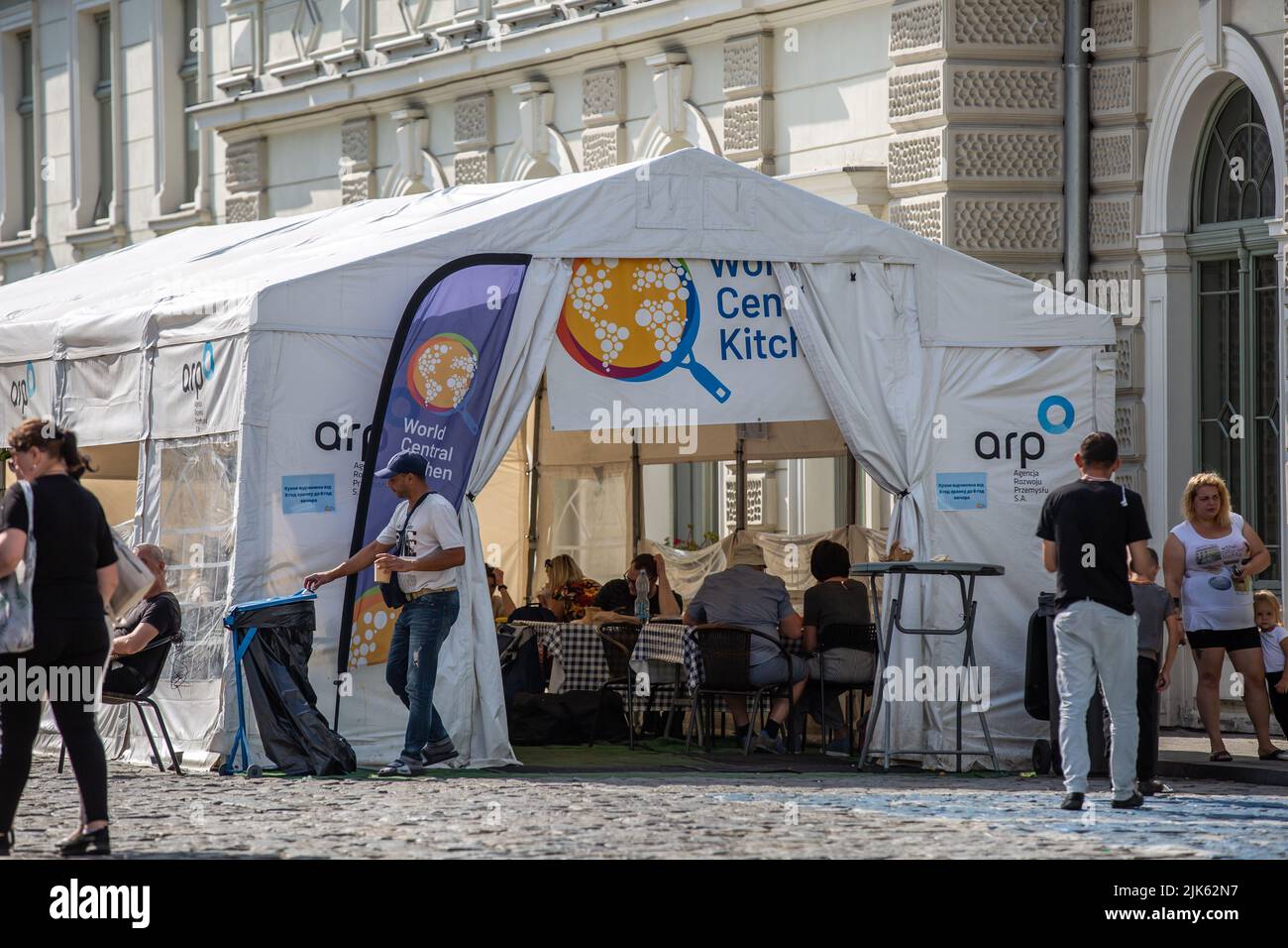 Przemysl, Poland - July 24, 2022: Unidentified people at the World Central Kitchen tent in Przemysl, Poland. Stock Photo
