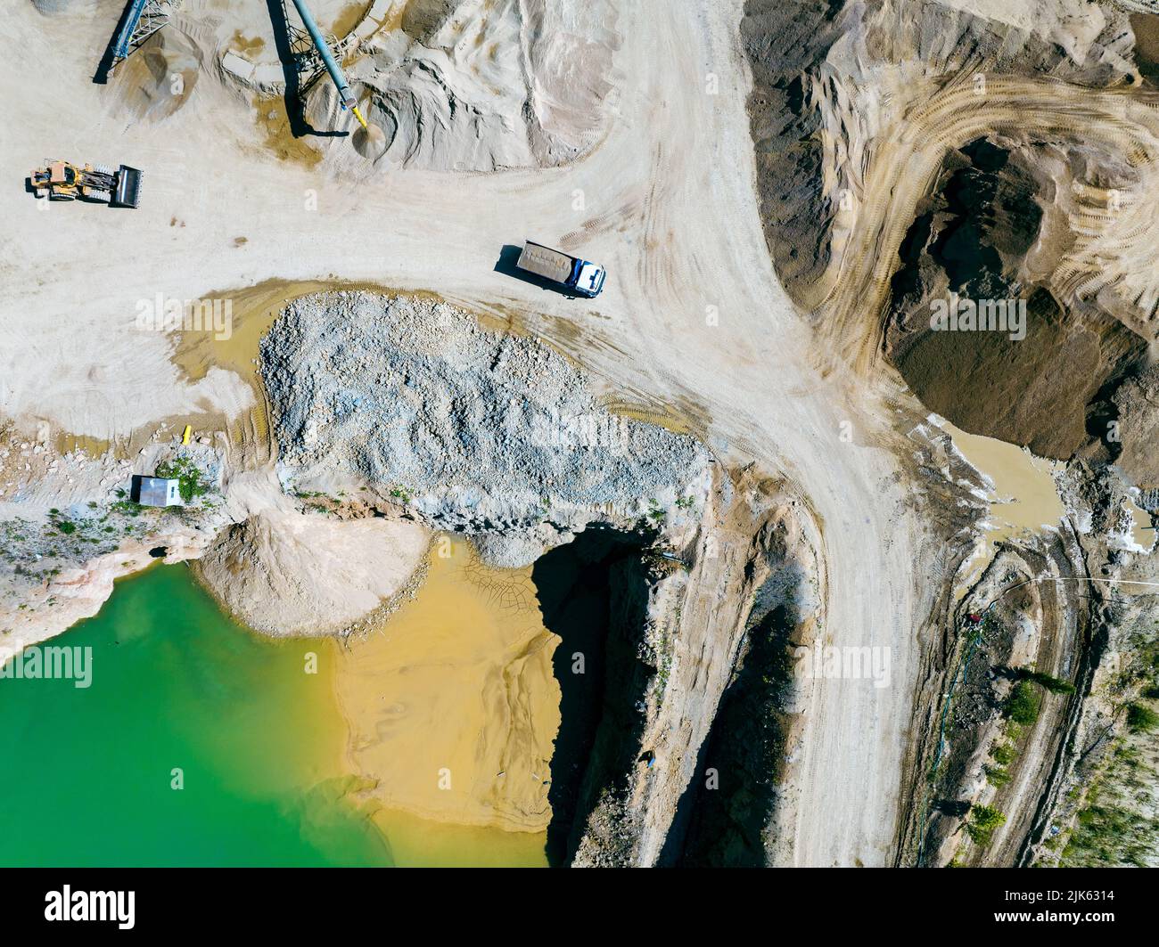 Dolomite Factory Plant Aerial View. Producing materials for construction industry, granite - gravel pit. Equipment for processing and crushing stones. - Stock Image