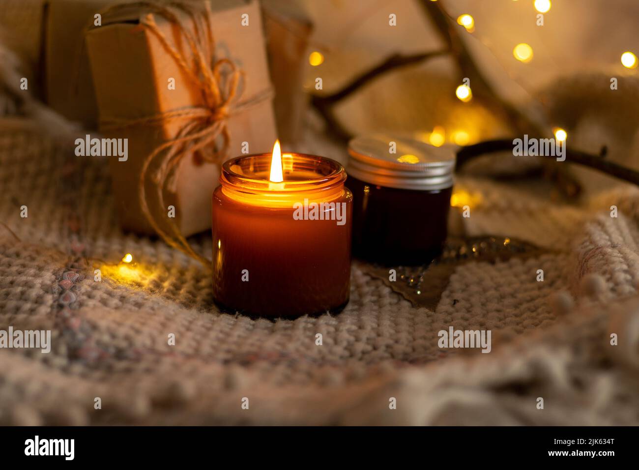 A set of different aroma candles in brown glass jars. Scented handmade ...