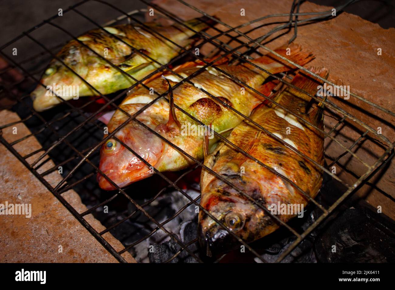 grilled fish Nile Tilapia on charcoal grill grilled fish Nile Tilapia