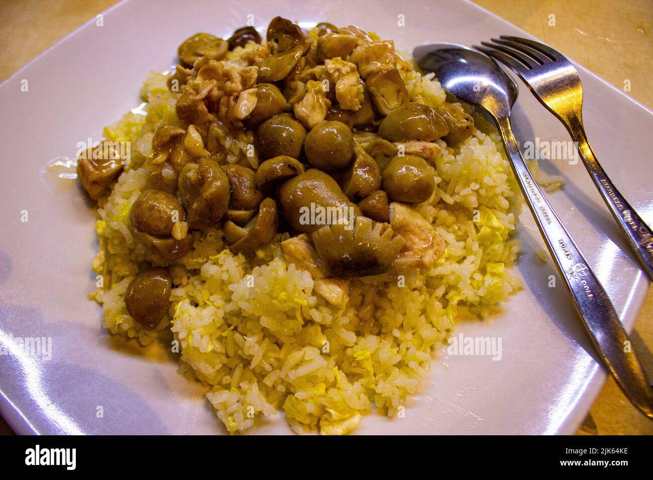 Hainanese chicken rice or or hainan rice or nasi ayam hainan served ...