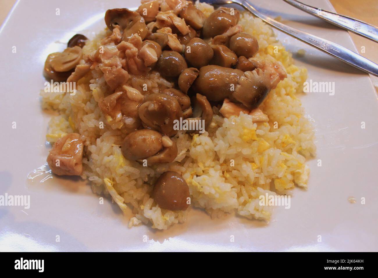 Hainanese chicken rice or or hainan rice or nasi ayam hainan served ...