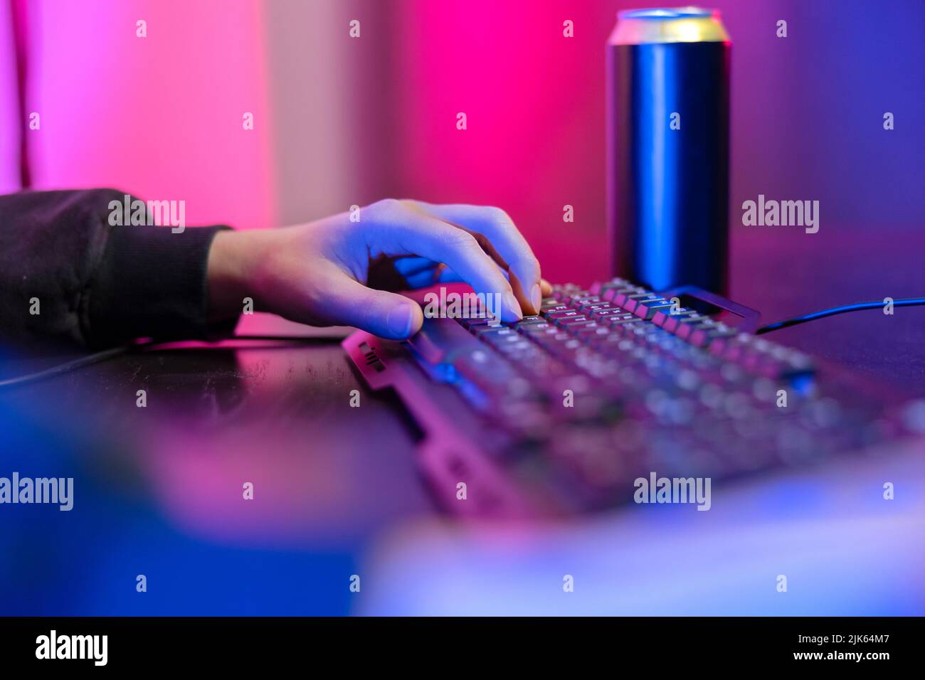 Close up of pro cyber sport gamer play game with keyboard and mouse Stock Photo