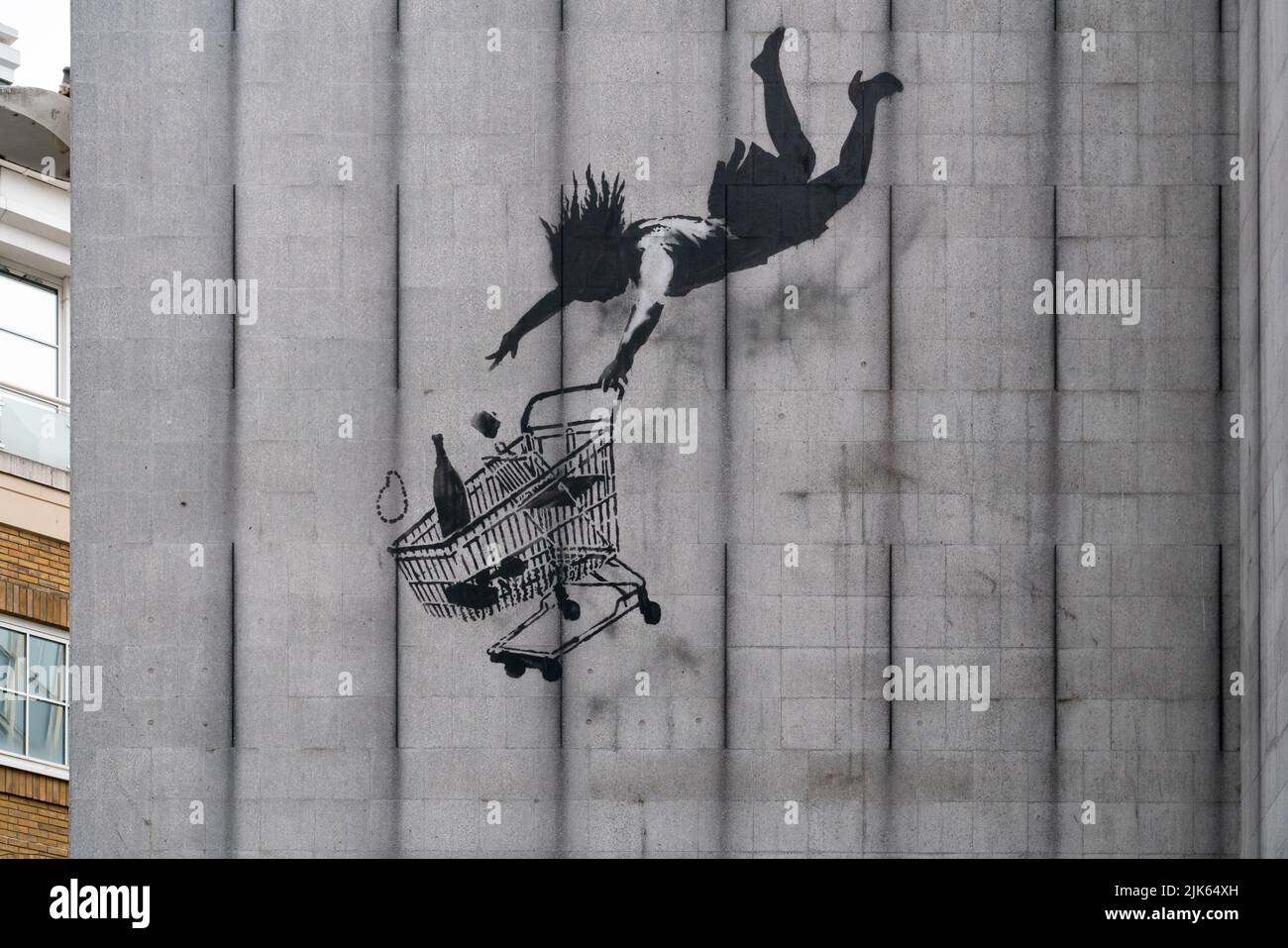 Banksy Falling Shopper, Bruton Lane, Mayfair London Stock Photo - Alamy