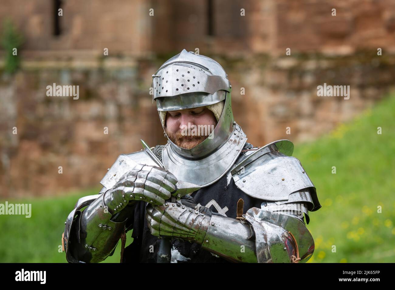 Knight in shining armor. Detail metal helmets. Medieval warrior. Stock Photo