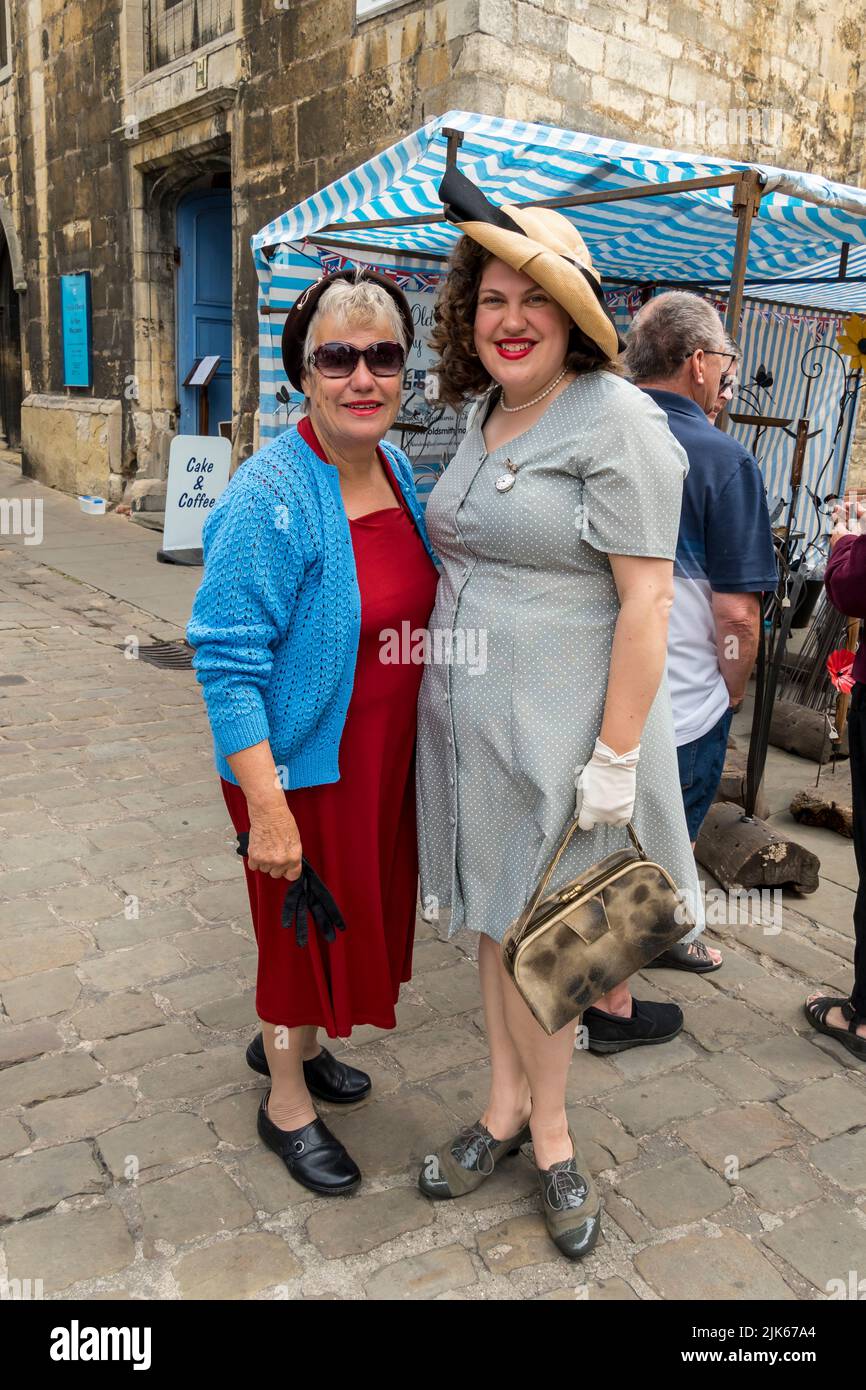 Mother and daugter dressed  and made up as 1940's style at Lincoln 1940's weekend, Lincoln Cathedral Quarter, 23rd July 2022 Stock Photo
